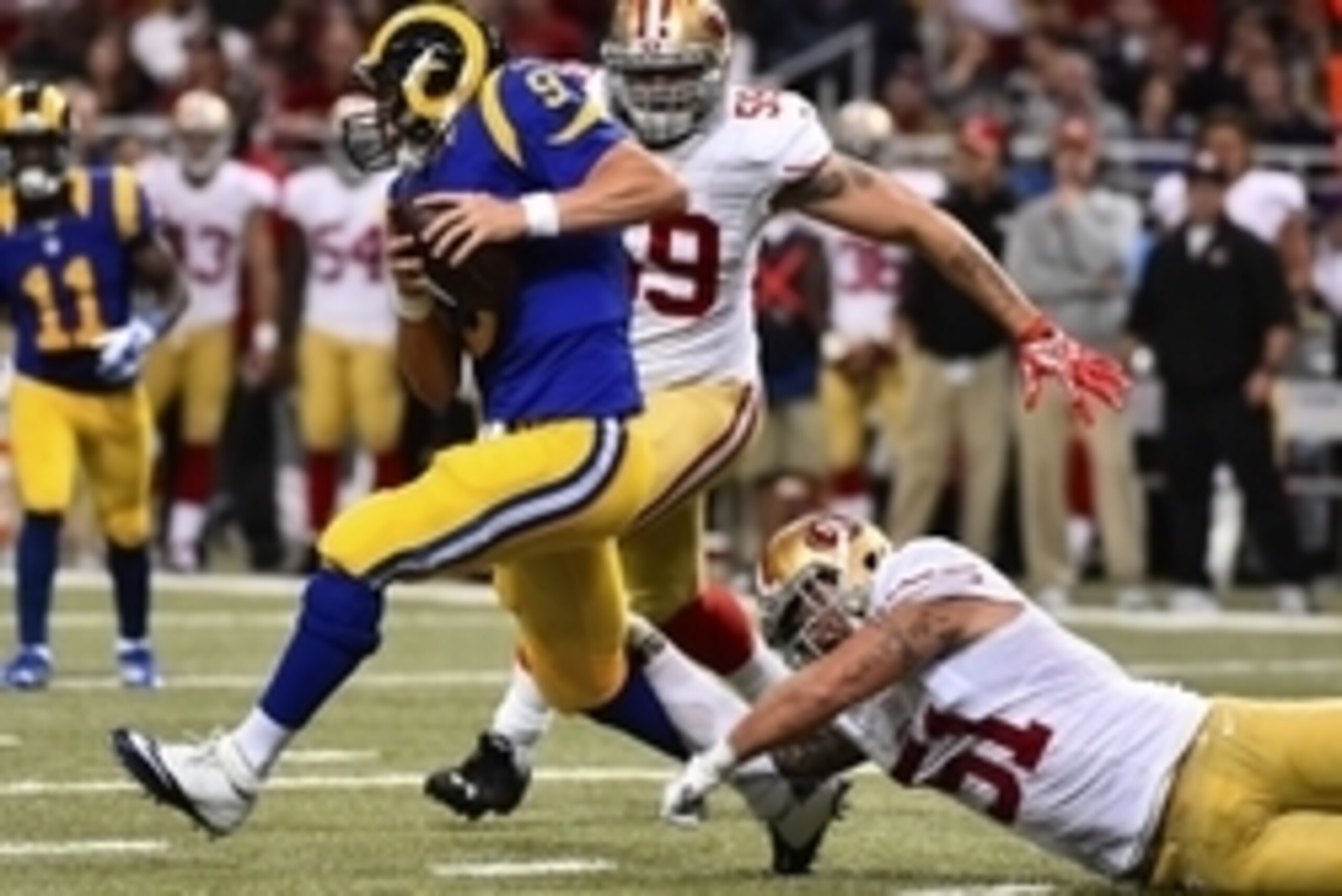 Oct 13, 2014; St. Louis, MO, USA; San Francisco 49ers outside linebacker Dan Skuta (51) attempts to tackle St. Louis Rams quarterback Austin Davis (9) during the first half at the Edward Jones Dome. Mandatory Credit: Jasen Vinlove-USA TODAY Sports