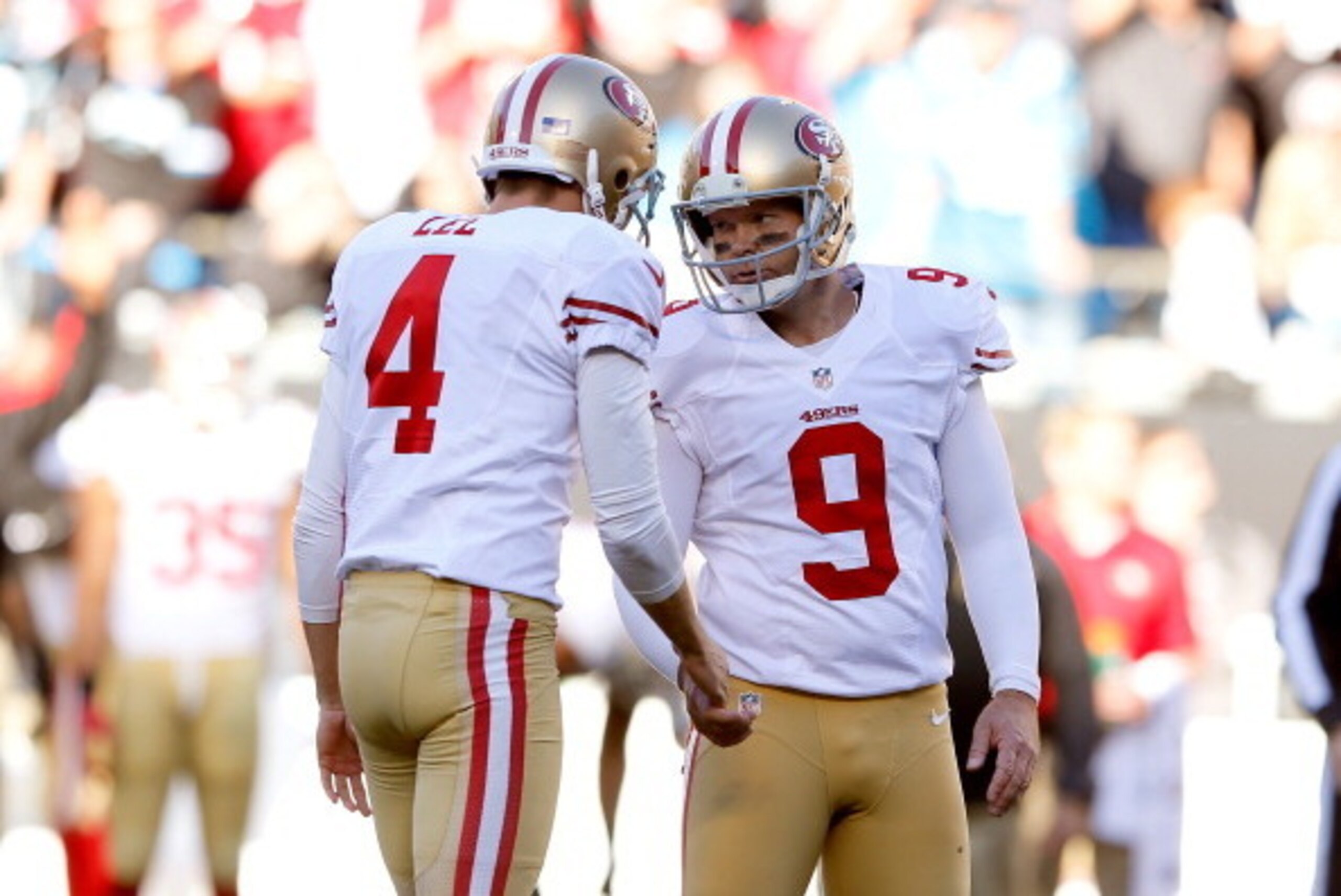 CHARLOTTE, NC - JANUARY 12: Phil Dawson #9 of the San Francisco 49ers and Andy Lee #4 of the San Francisco 49ers celebrate after a field goal by Dawson in the fourth quarter against the Carolina Panthers during the NFC Divisional Playoff Game at Bank of A