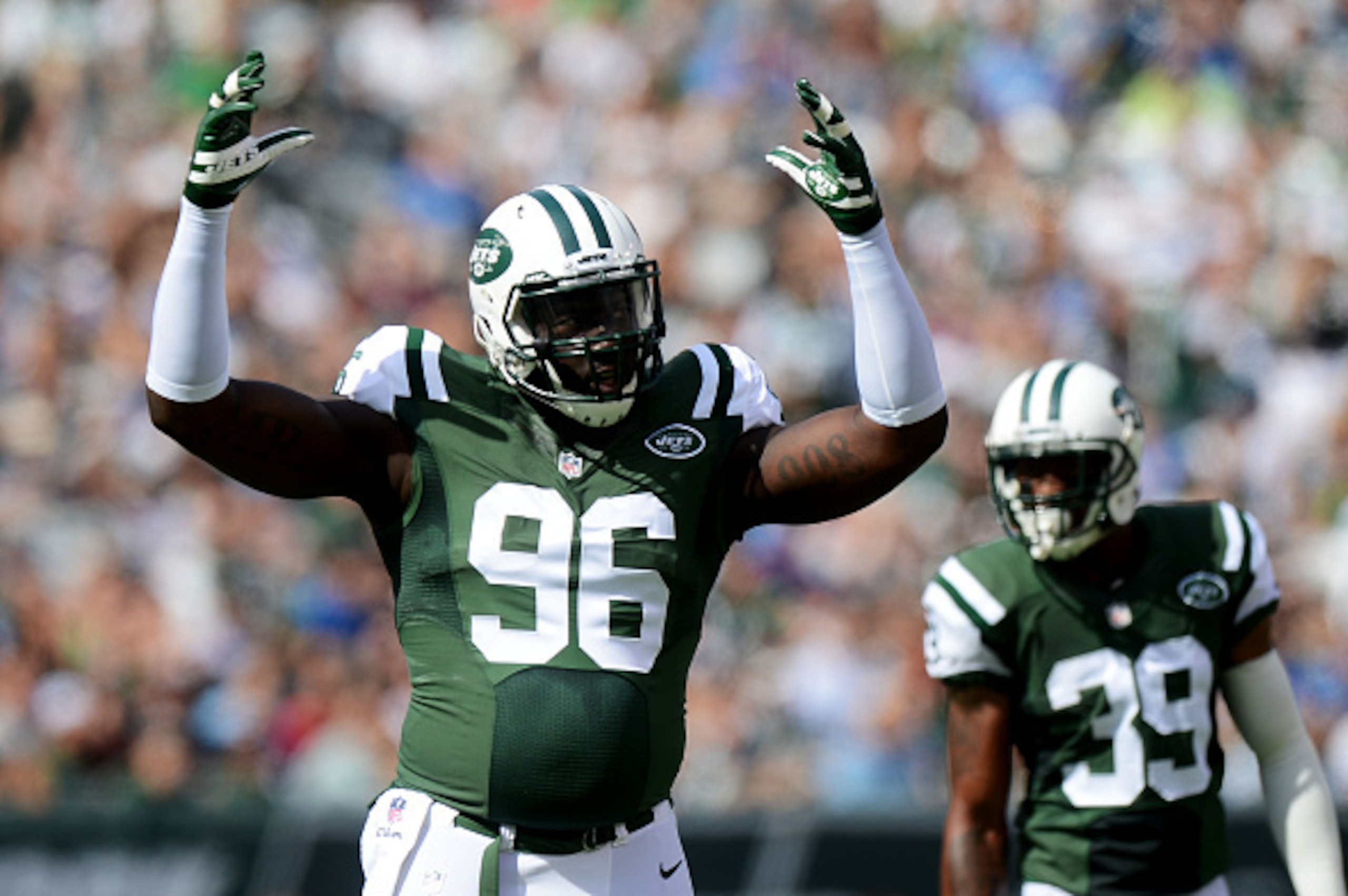 EAST RUTHERFORD, NJ - SEPTEMBER 28:   Muhammad Wilkerson #96 of the New York Jets reacts in the first quarter against the Detroit Lions at MetLife Stadium on September 28, 2014 in East Rutherford, New Jersey.  (Photo by Ron Antonelli/Getty Images)