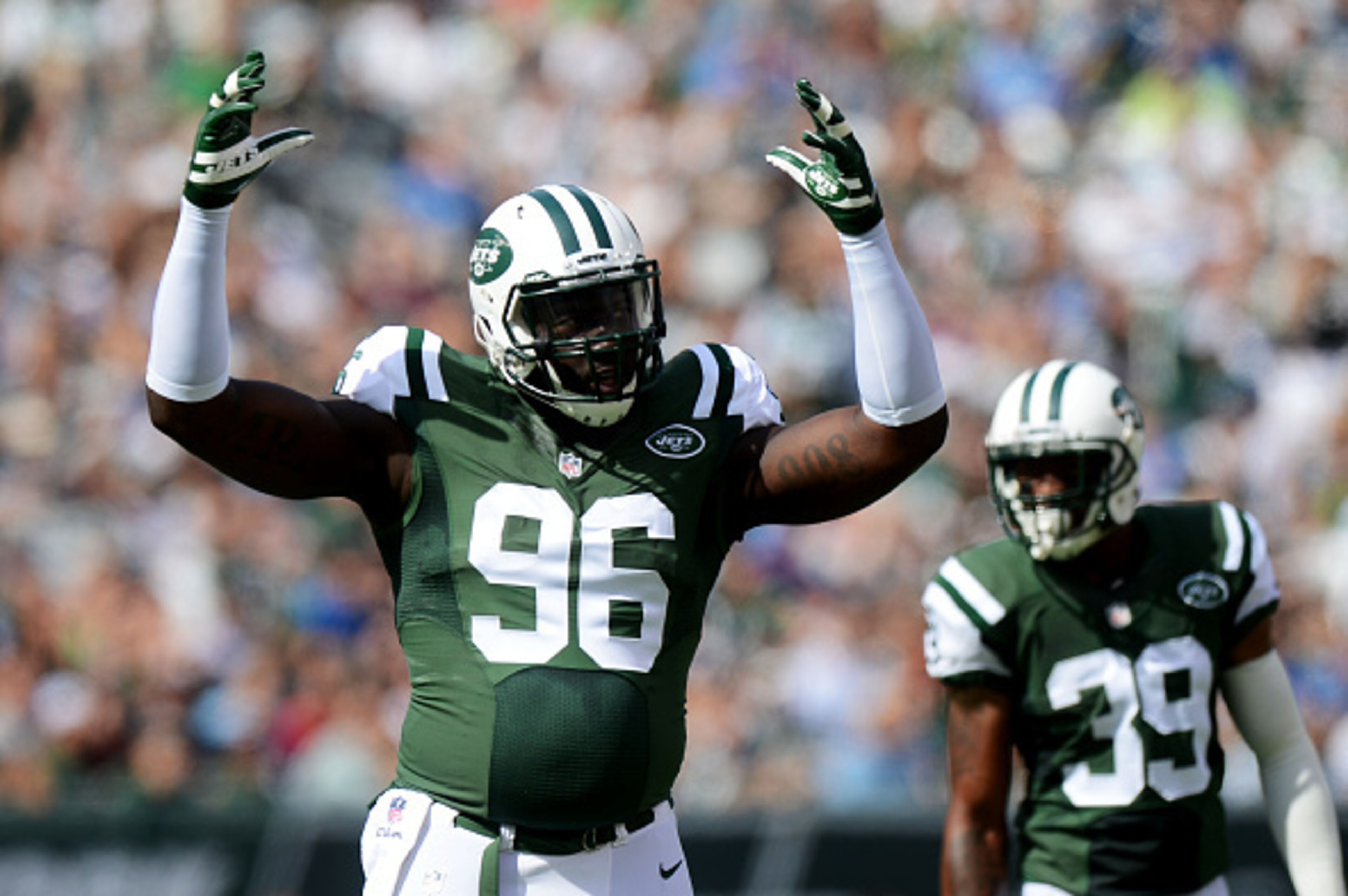 EAST RUTHERFORD, NJ - SEPTEMBER 28:   Muhammad Wilkerson #96 of the New York Jets reacts in the first quarter against the Detroit Lions at MetLife Stadium on September 28, 2014 in East Rutherford, New Jersey.  (Photo by Ron Antonelli/Getty Images)