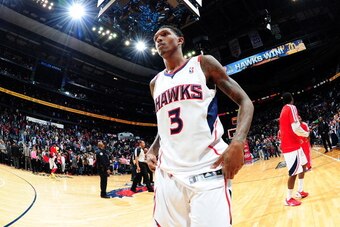ATLANTA, GA - JANUARY 10:  Louis Williams #3 of the Atlanta Hawks walking off the court after a game agsint the Houston Rockets on January 10, 2014 at Philips Arena in Atlanta, Georgia.  NOTE TO USER: User expressly acknowledges and agrees that, by downlo