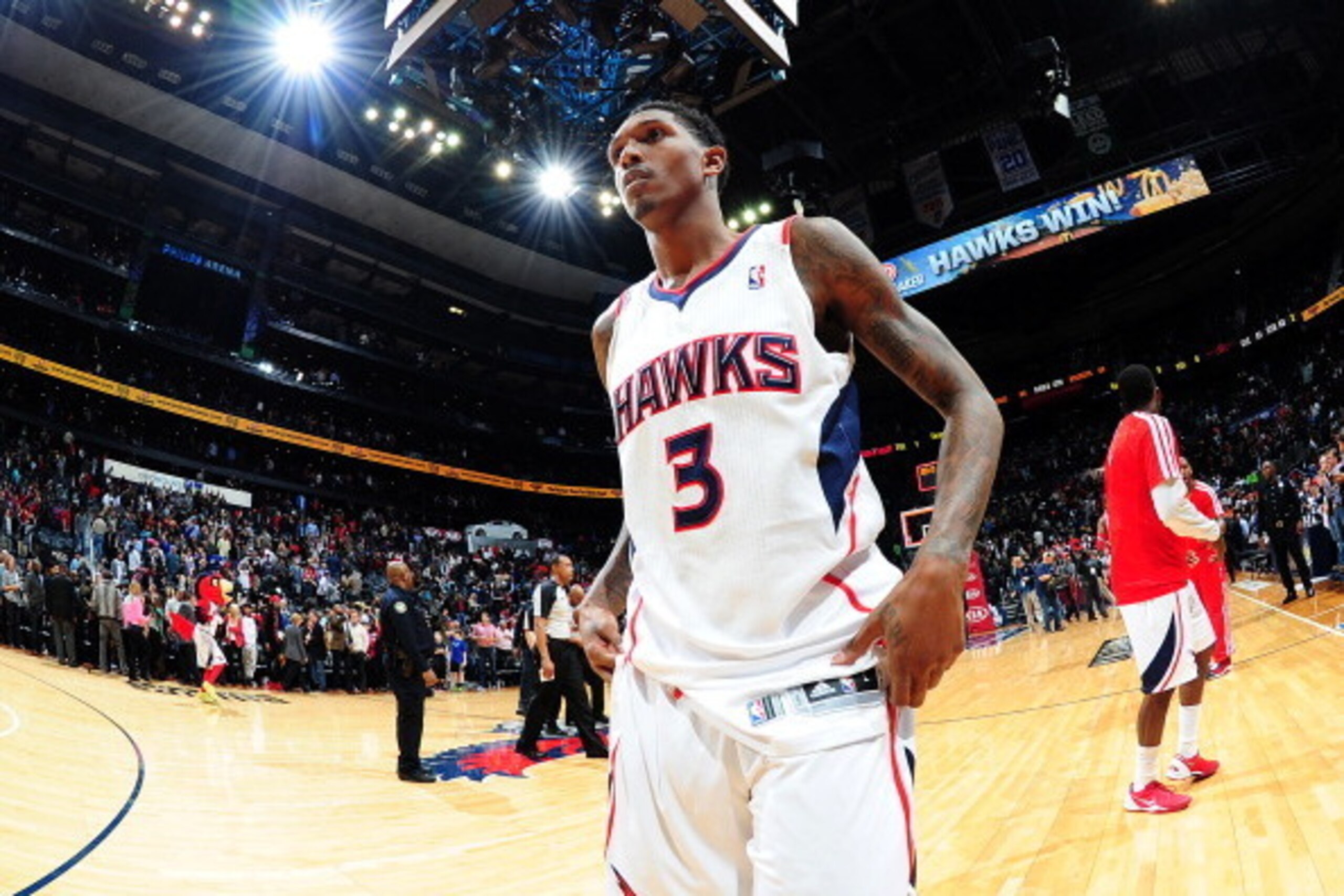 ATLANTA, GA - JANUARY 10:  Louis Williams #3 of the Atlanta Hawks walking off the court after a game agsint the Houston Rockets on January 10, 2014 at Philips Arena in Atlanta, Georgia.  NOTE TO USER: User expressly acknowledges and agrees that, by downlo