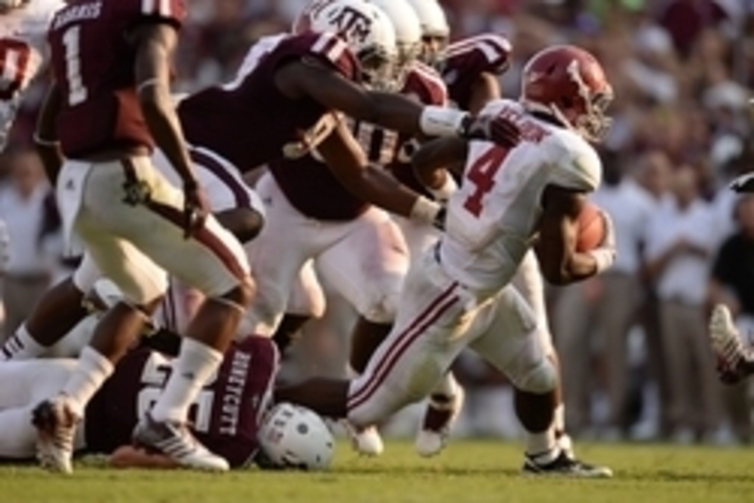 Sep 14, 2013; College Station, TX, USA; Alabama Crimson Tide running back T.J. Yeldon (4) rushes against the Texas A&M Aggies during the second half at Kyle Field. Mandatory Credit: Thomas Campbell-USA TODAY Sports