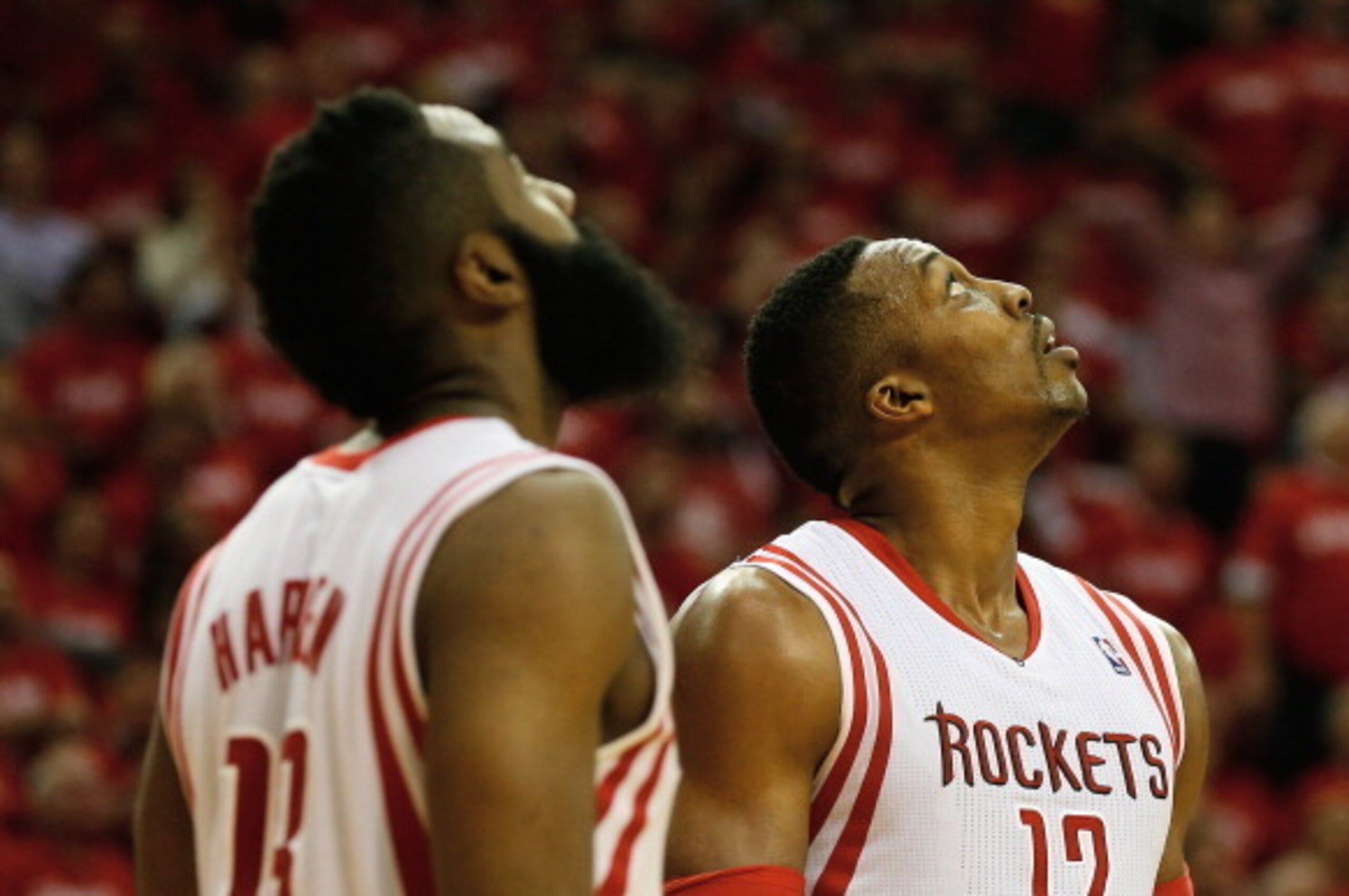 HOUSTON, TX - APRIL 23:  James Harden #13 and Dwight Howard #12 of the Houston Rockets reviews a play against the Portland Trail Blazers during the first half in Game Two of the Western Conference Quarterfinals during the 2014 NBA Playoffs at Toyota Cente