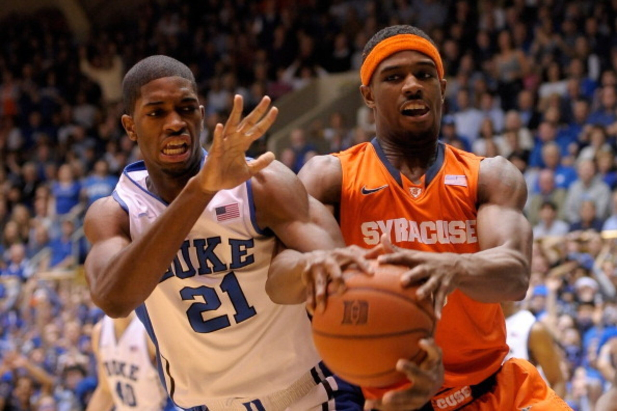 DURHAM, NC - FEBRUARY 22: Amile Jefferson #21 of the Duke Blue Devils battle for the ball with C.J. Fair #5 of the Syracuse Orange during their game at Cameron Indoor Stadium on February 22, 2014 in Durham, North Carolina. (Photo by Grant Halverson/Gett DURHAM, NC - FEBRUARY 22: Amile Jefferson #21 of the Duke Blue Devils battle for the ball with C.J. Fair #5 of the Syracuse Orange during their game at Cameron Indoor Stadium on February 22, 2014 in Durham, North Carolina. (Photo by Grant Halverson/Gett
