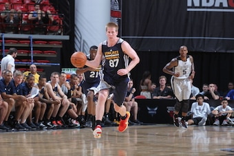 LAS VEGAS, NV - JULY 14: Brock Motum #87 of the Utah Jazz drives against the Milwaukee Bucks at the Samsung NBA Summer League 2014 on July 14, 2014 at the Thomas & Mack Center in Las Vegas, Nevada. NOTE TO USER: User expressly acknowledges and agrees that