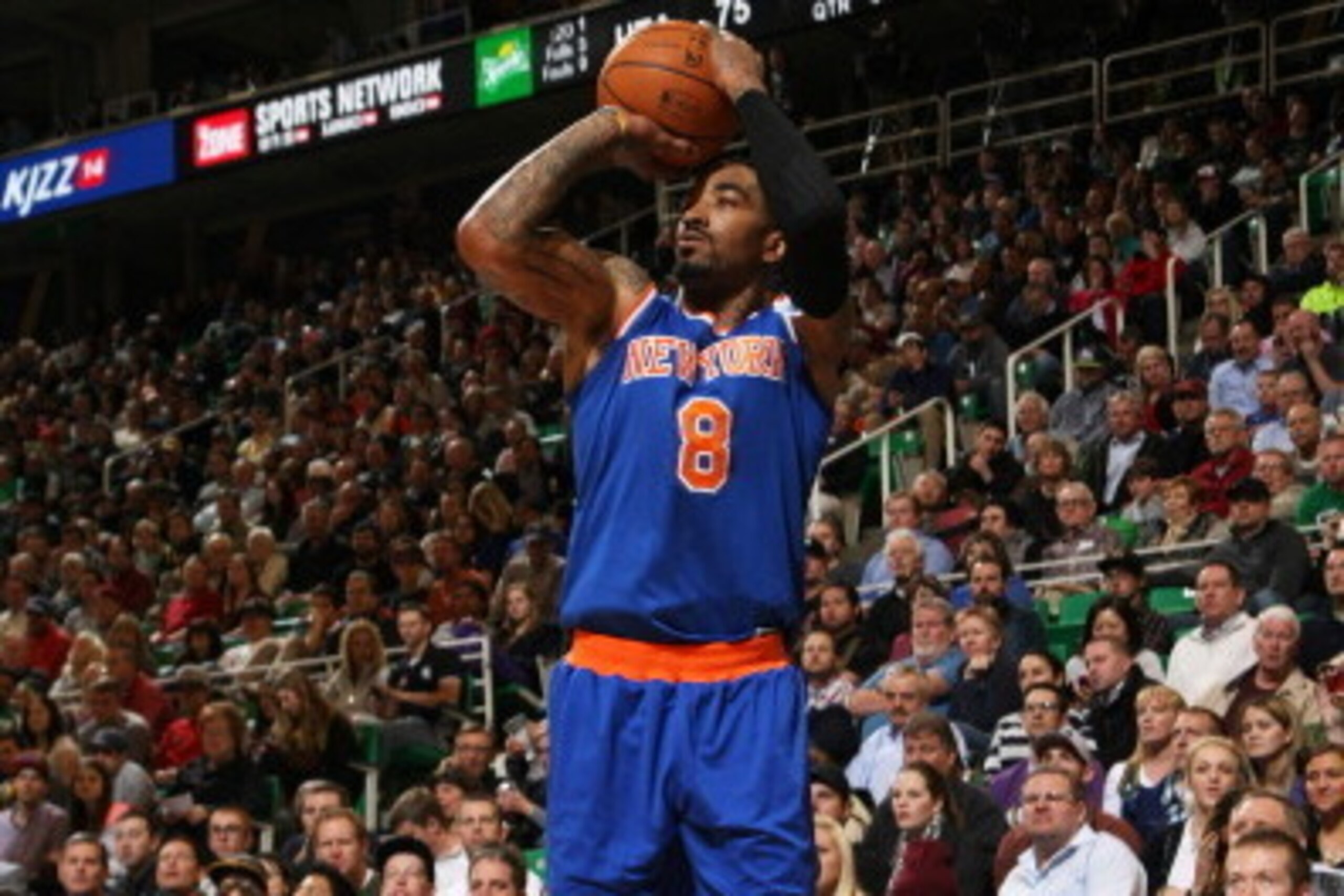 SALT LAKE CITY, UT - MARCH 31:  J.R. Smith #8 of the New York Knicks takes a shot against the Utah Jazz at EnergySolutions Arena on March 31, 2014 in Salt Lake City, Utah. NOTE TO USER: User expressly acknowledges and agrees that, by downloading and or us