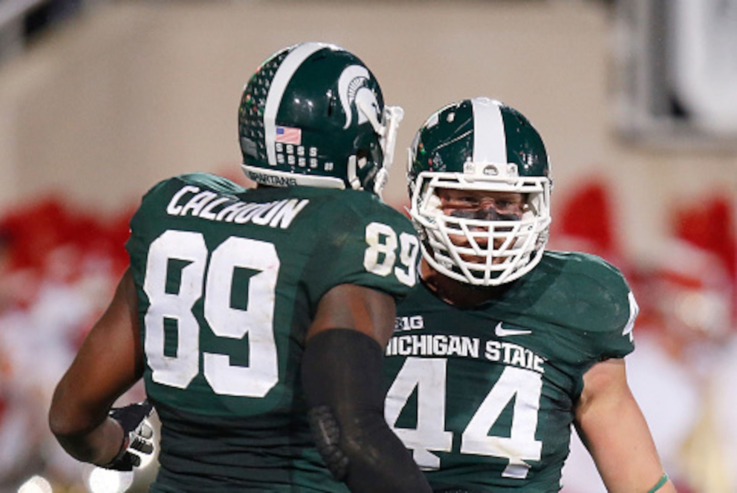 EAST LANSING, MI - OCTOBER 04: Marcus Rush #44 of the Michigan State Spartans celebrates a third quarter sack with Shilique Calhoun #89 while playing the Nebraska Cornhuskers at Spartan Stadium on October 4, 2014 in East Lansing, Michigan. (Photo by Grego