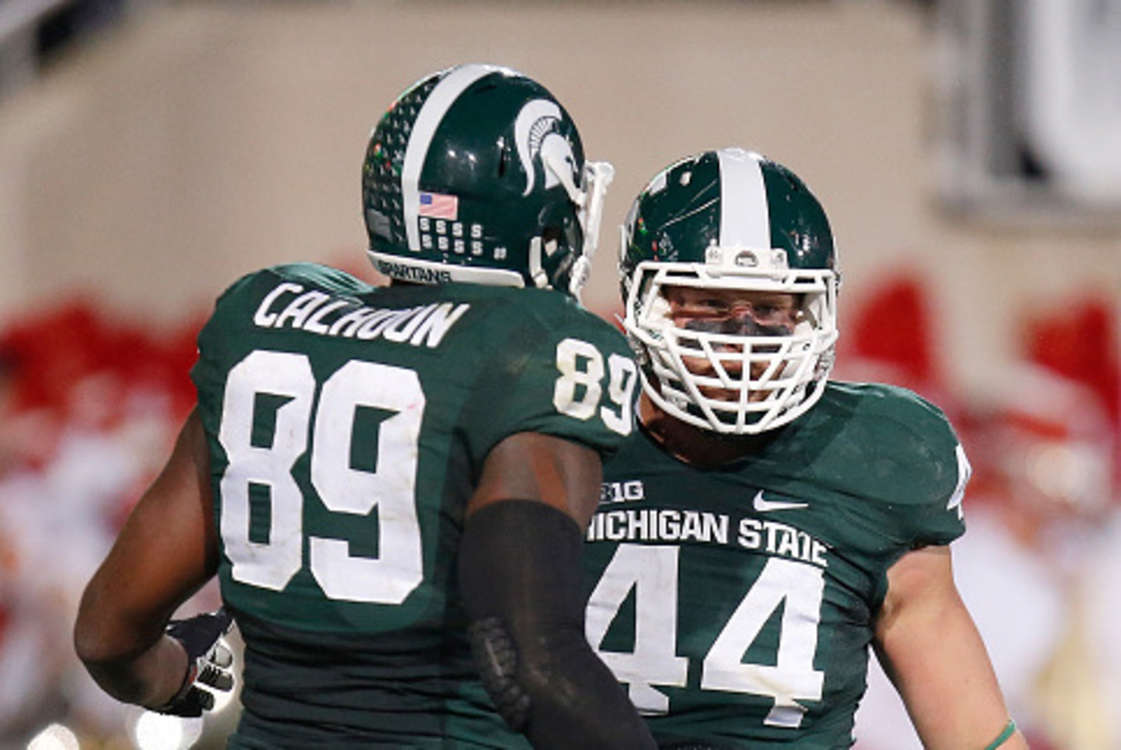 EAST LANSING, MI - OCTOBER 04: Marcus Rush #44 of the Michigan State Spartans celebrates a third quarter sack with Shilique Calhoun #89 while playing the Nebraska Cornhuskers at Spartan Stadium on October 4, 2014 in East Lansing, Michigan. (Photo by Grego