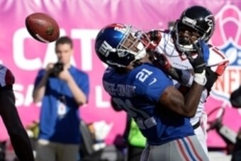 Oct 5, 2014; East Rutherford, NJ, USA; New York Giants cornerback Dominique Rodgers-Cromartie (21) breaks up a pass intended for Atlanta Falcons wide receiver Devin Hester (17) during the game at MetLife Stadium. Mandatory Credit: Robert Deutsch-USA TODAY