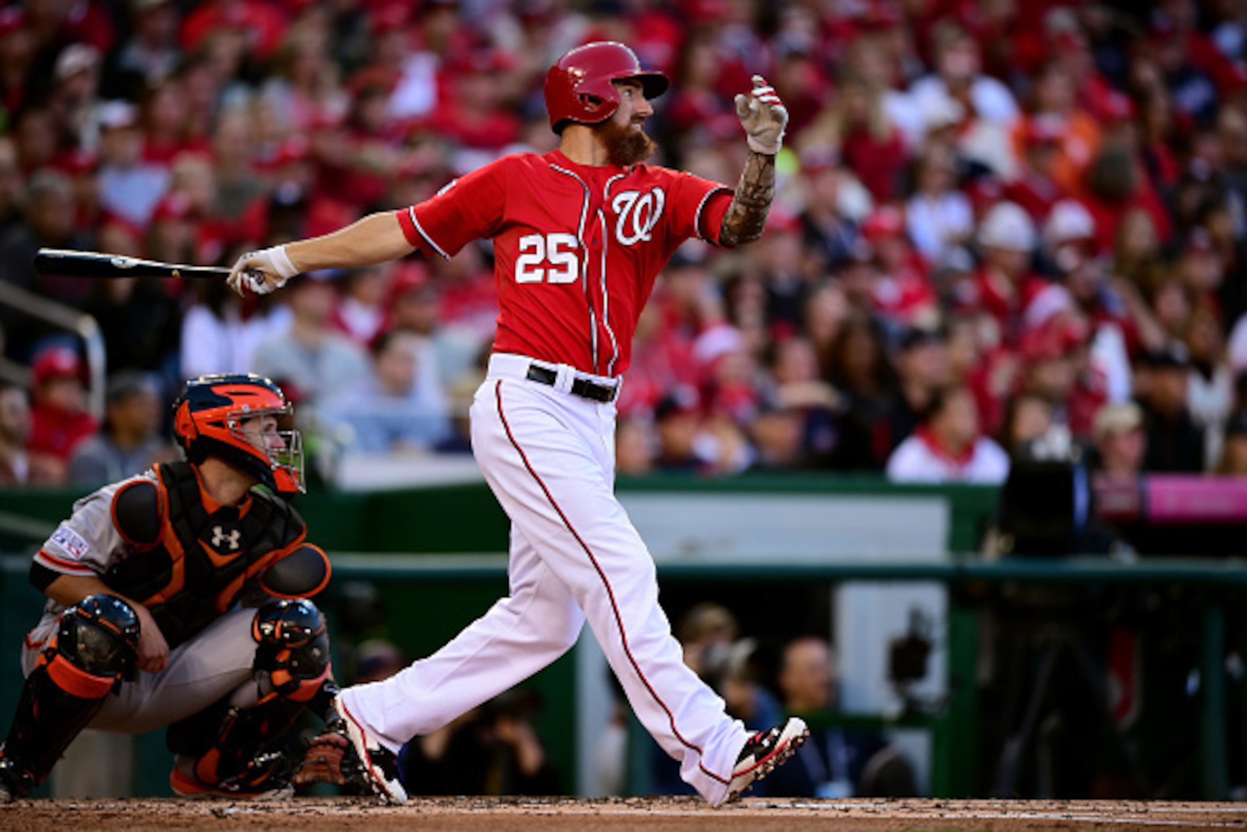WASHINGTON, DC - OCTOBER 04:  Adam LaRoche #25 of the Washington Nationals lined out to left field in the first inning against Tim Hudson #17 of the San Francisco Giants during Game Two of the National League Division Series at Nationals Park on October 4