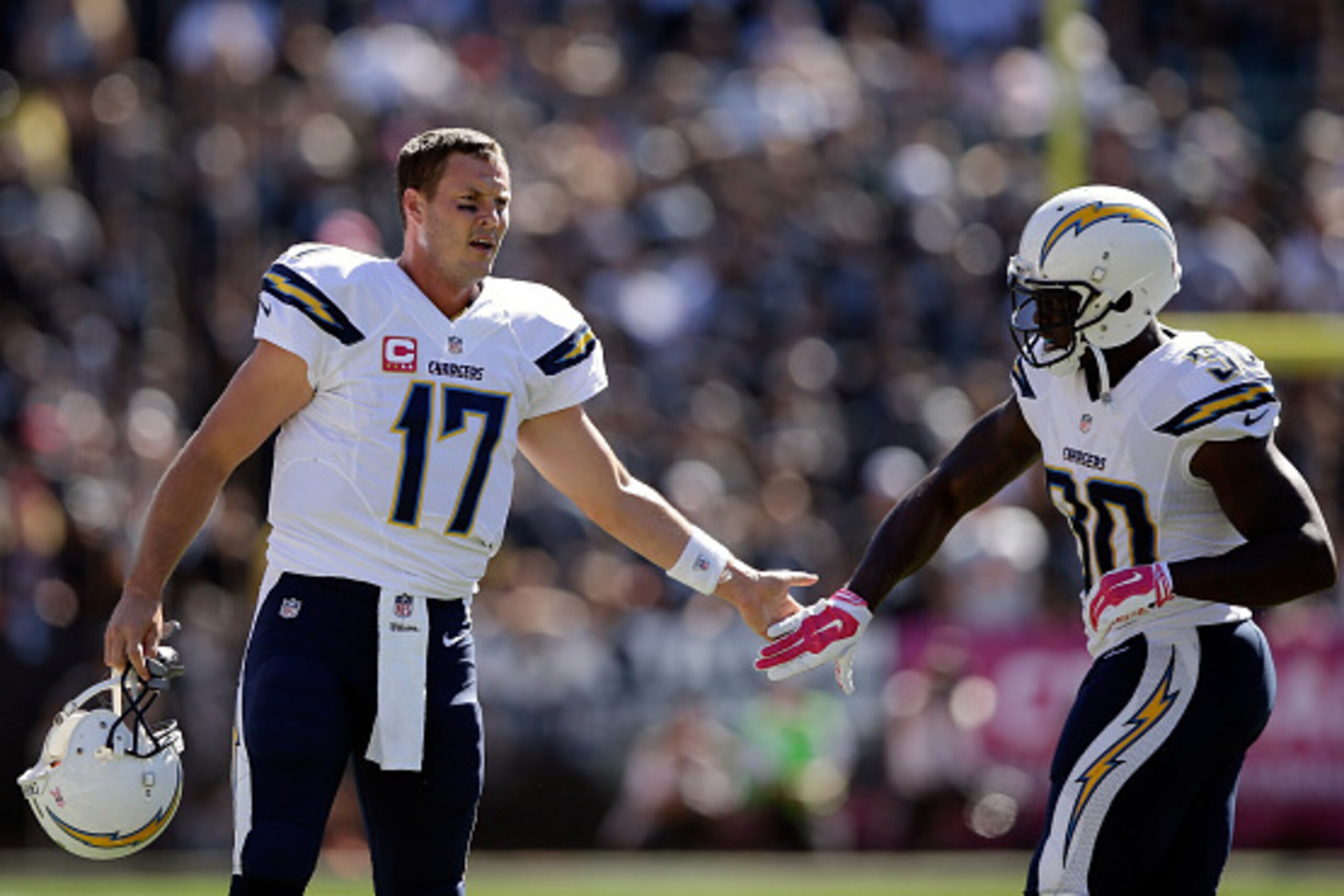OAKLAND, CA - OCTOBER 12: Philip Rivers #17 and Malcom Floyd #80 of the San Diego Chargers high five after Rivers threw a touchdown pass to Eddie Royal #11 of the San Diego Chargers in the first quarter of their game against the Oakland Raiders at O.co C OAKLAND, CA - OCTOBER 12: Philip Rivers #17 and Malcom Floyd #80 of the San Diego Chargers high five after Rivers threw a touchdown pass to Eddie Royal #11 of the San Diego Chargers in the first quarter of their game against the Oakland Raiders at O.co C