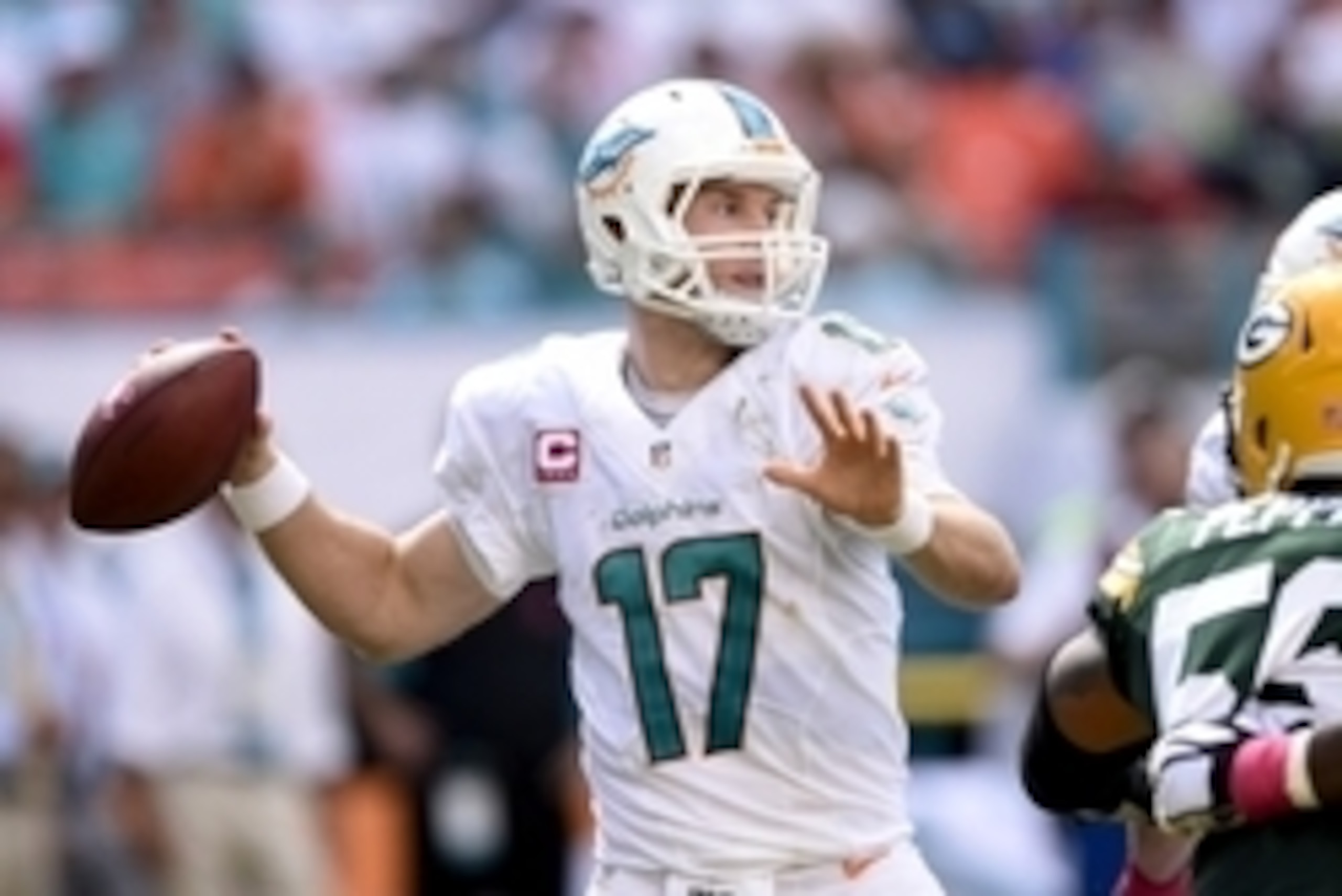Oct 12, 2014; Miami Gardens, FL, USA; Miami Dolphins quarterback Ryan Tannehill (17) throws a pass against the Green Bay Packers in the second quarter of the game at Sun Life Stadium. Mandatory Credit: Brad Barr-USA TODAY Sports