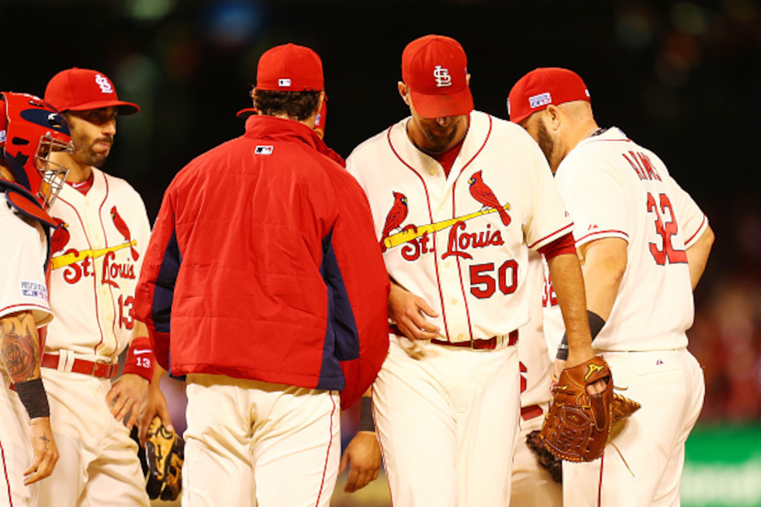 ST LOUIS, MO - OCTOBER 11:  Adam Wainwright #50 of the St. Louis Cardinals is removed from the game in the fifth inning by manager Mike Matheny #22 during Game One of the National League Championship Series against the San Francisco Giants at Busch Stadiu
