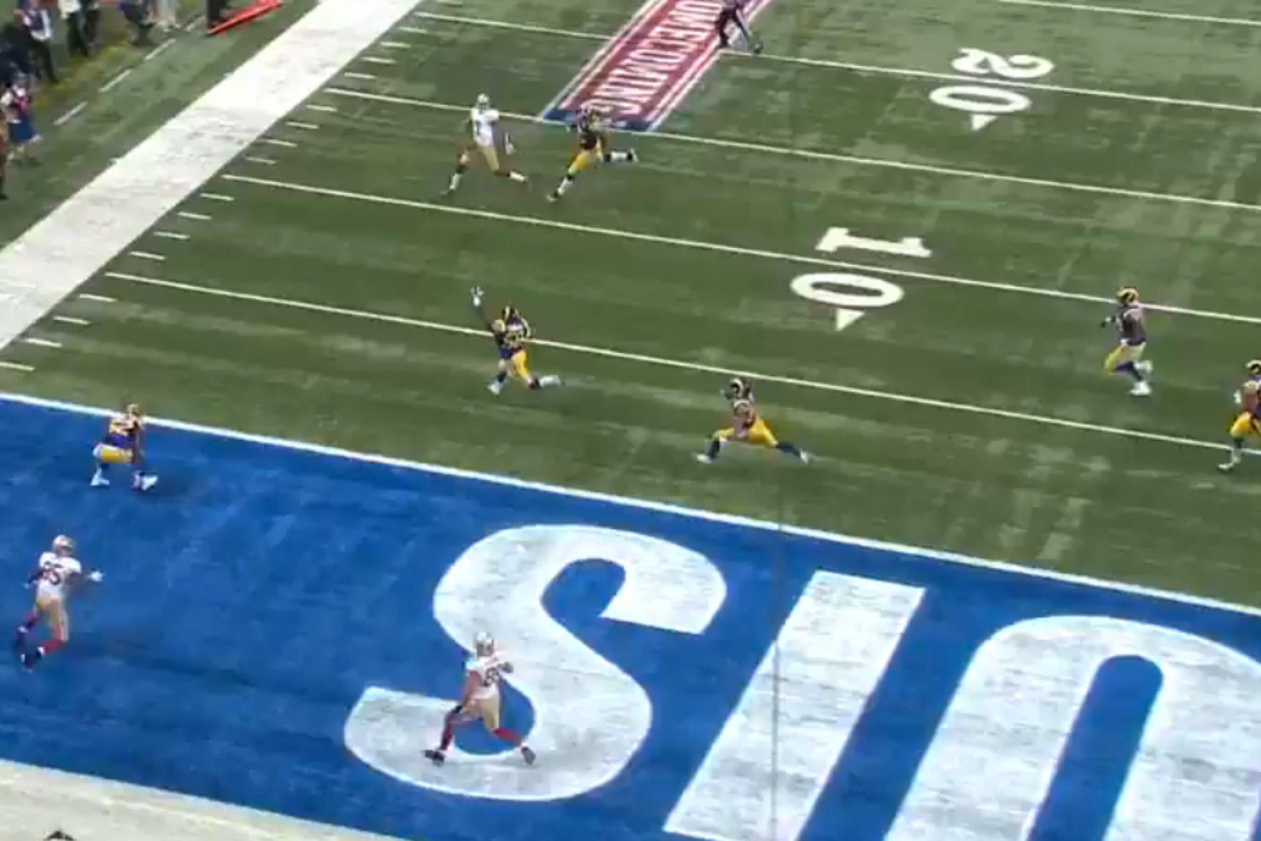 As Kap releases the ball, three St. Louis defenders are more focused on his running threat than the two receivers behind them.