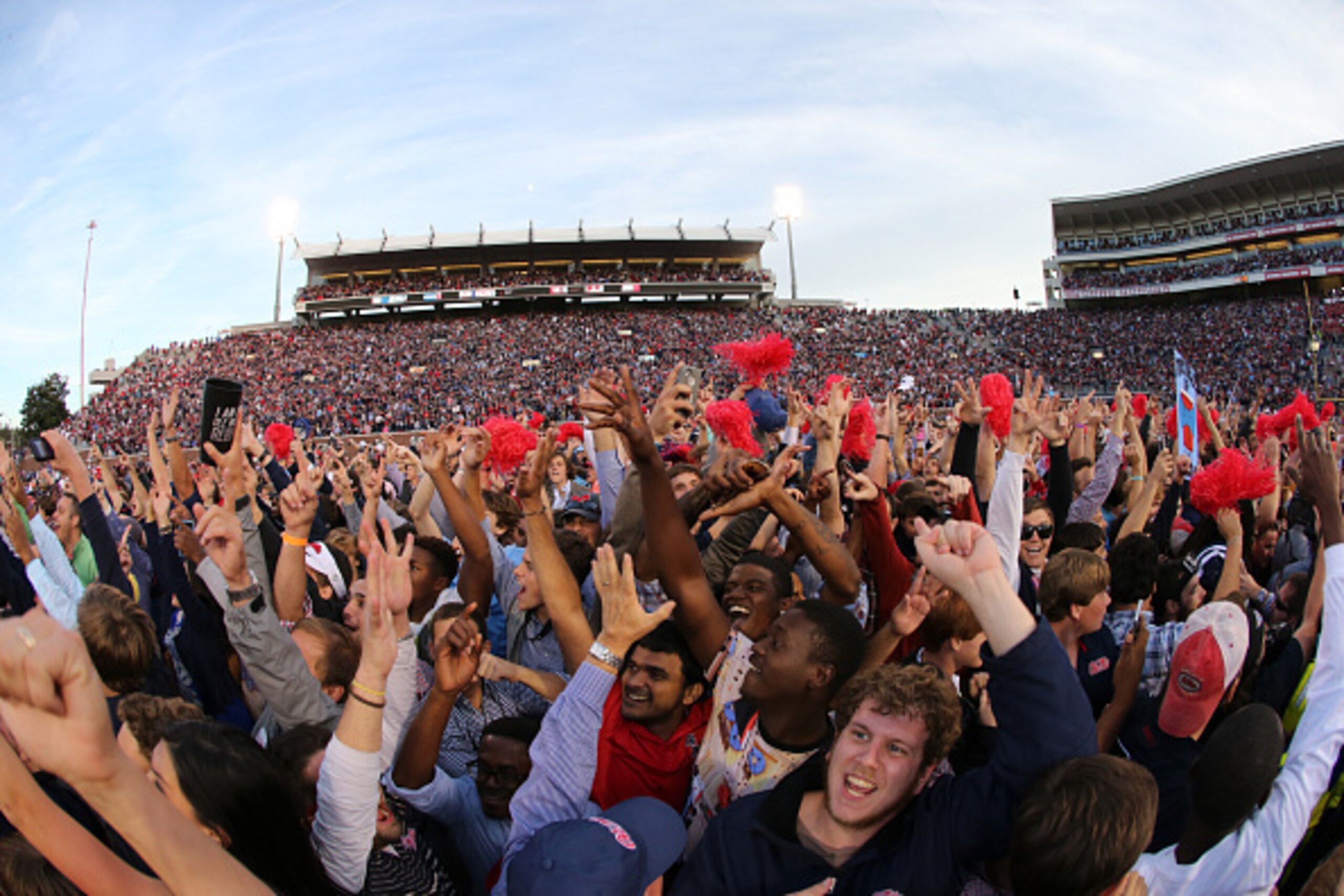 OXFORD, MS - OCTOBER 4: Fans of the Ole Miss Rebels rush the field to celebrate the victory over the Alabama Crimson Tide on October 4, 2014 at Vaught-Hemingway Stadium in Oxford, Mississippi. Mississippi beat Alabama 23-17. (Photo by Joe Murphy/Getty Ima