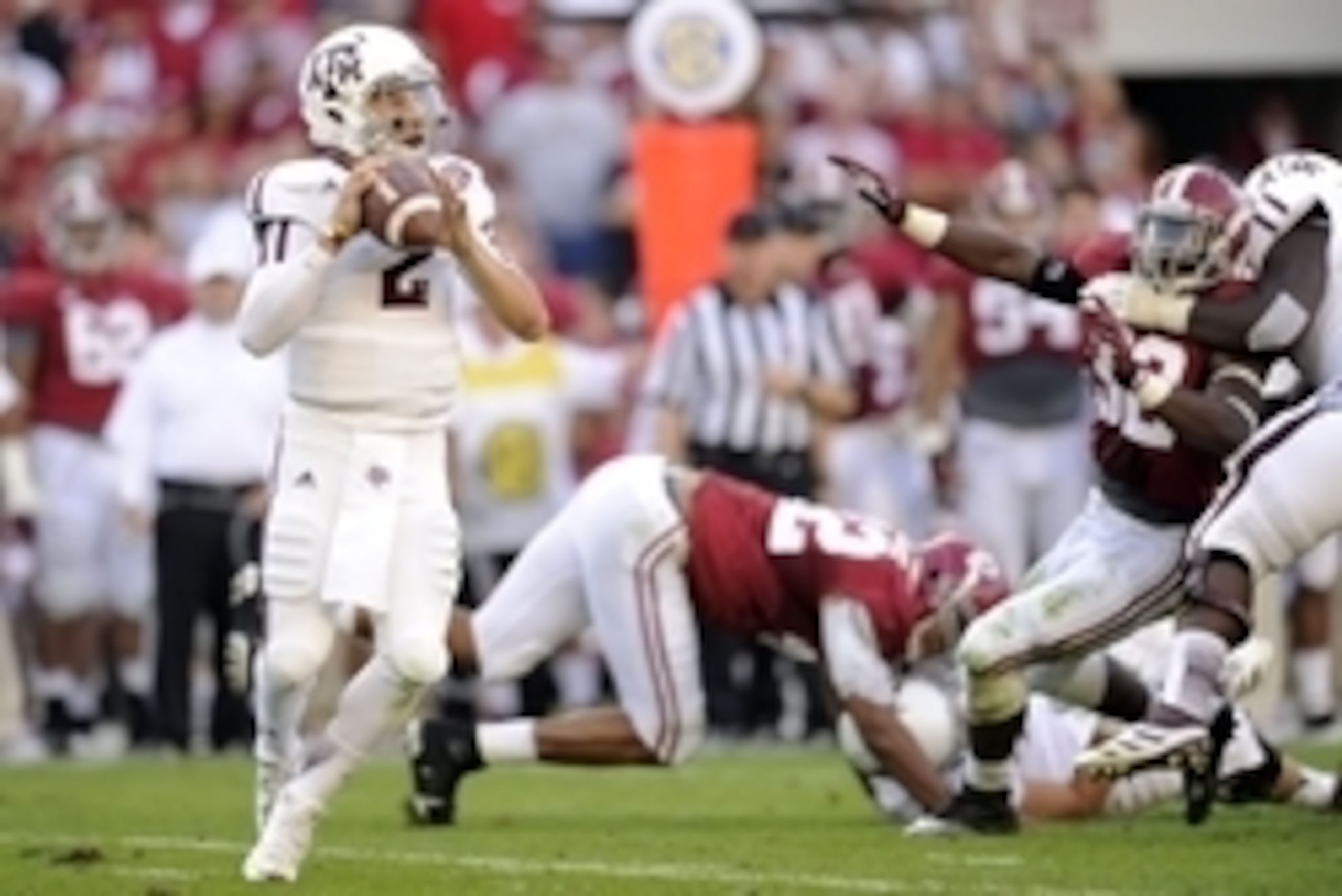 November 10, 2012; Tuscaloosa, AL, USA;  Texas A&M Aggies quarterback Johnny Manziel (2) rolls out to pass against the Alabama Crimson Tide during second quarter of their football game at Bryant Denny Stadium. Mandatory Credit: John David Mercer-USA TODAY
