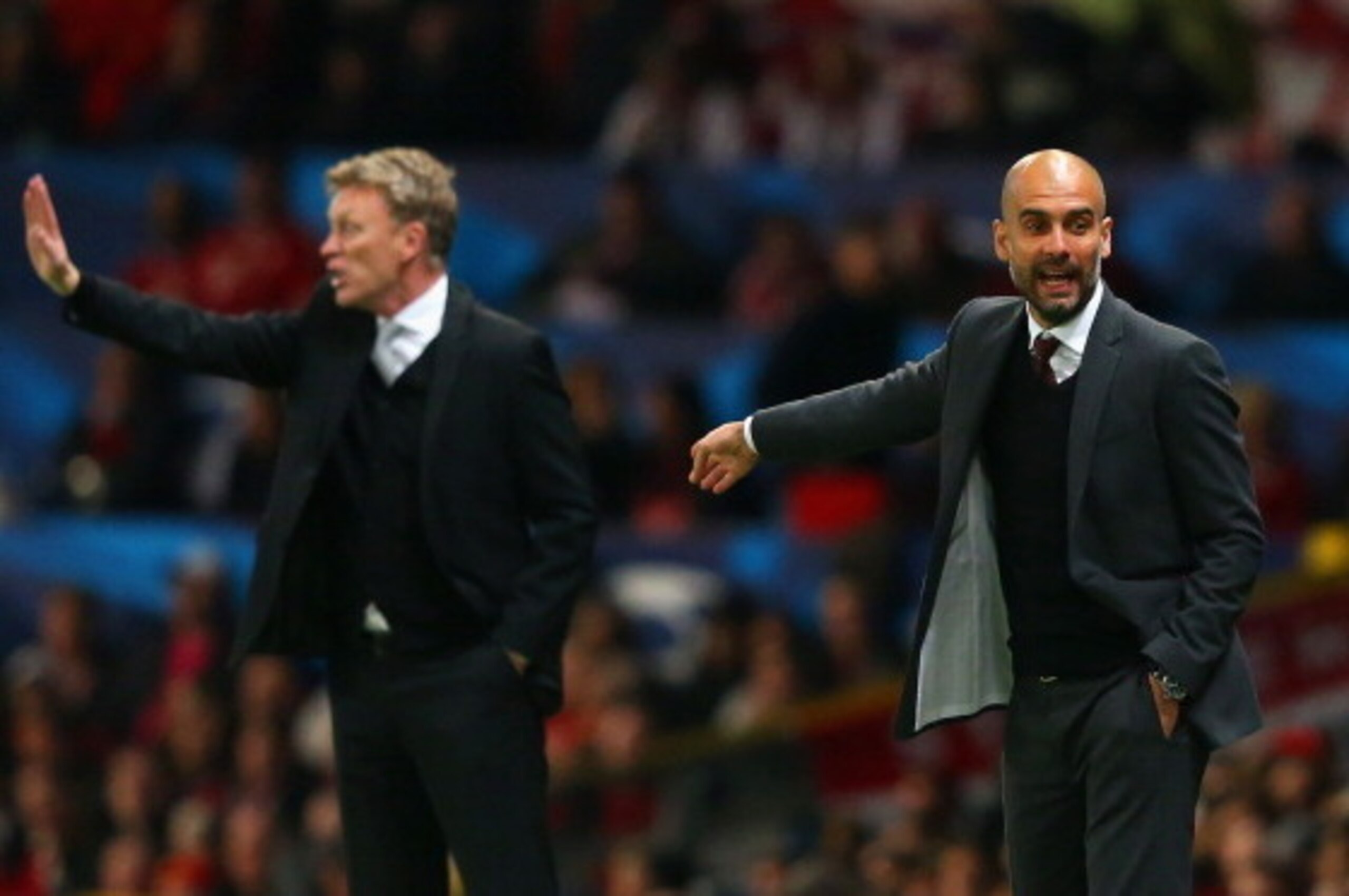 MANCHESTER, ENGLAND - APRIL 01: David Moyes manager of Manchester United and Pep Guardiola head coach of Bayern Muenchen give instructions during the UEFA Champions League Quarter Final first leg match between Manchester United and FC Bayern Muenchen at MANCHESTER, ENGLAND - APRIL 01: David Moyes manager of Manchester United and Pep Guardiola head coach of Bayern Muenchen give instructions during the UEFA Champions League Quarter Final first leg match between Manchester United and FC Bayern Muenchen at