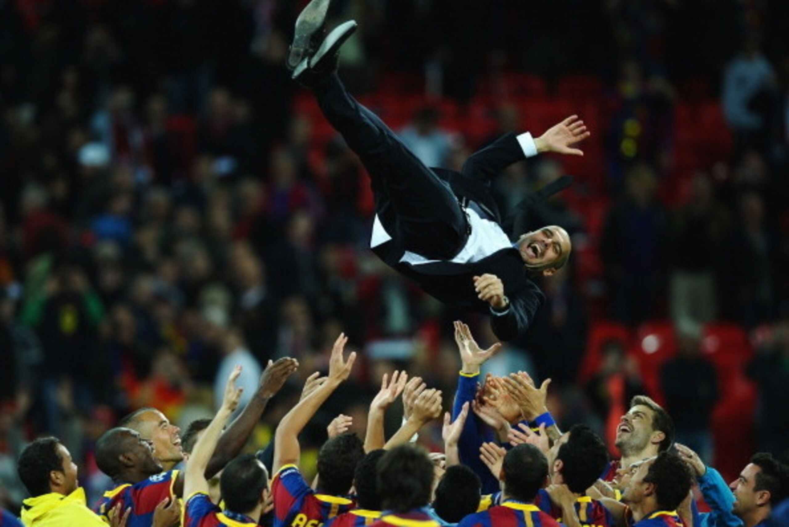 LONDON, ENGLAND - MAY 28:  Josep Guardiola manager of FC Barcelona is thrown in the air as Barcelona celebrate victory in UEFA Champions League final between FC Barcelona and Manchester United FC at Wembley Stadium on May 28, 2011 in London, England.  (Ph