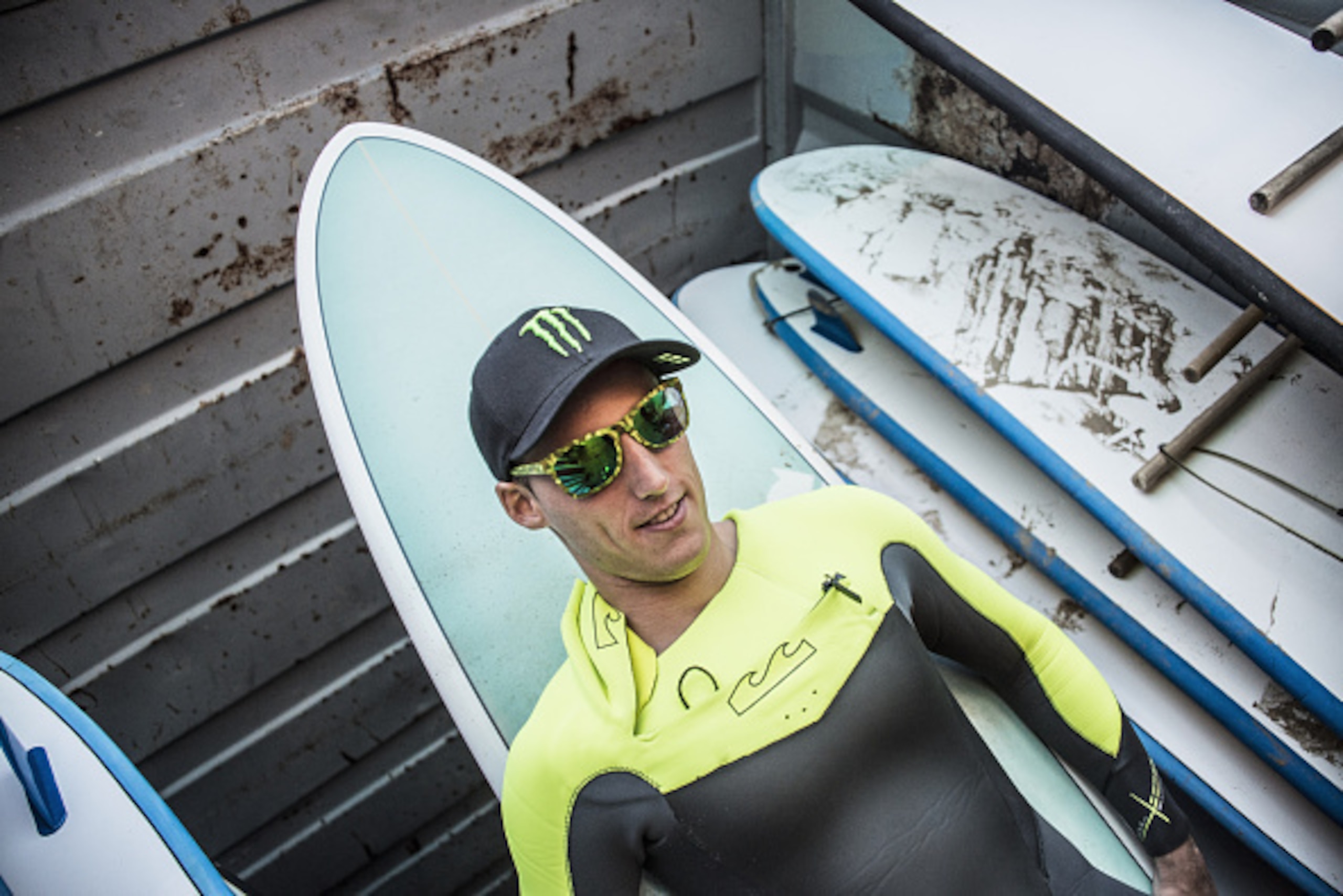 PHILLIP ISLAND, AUSTRALIA - OCTOBER 16:   Pol Espargaro of Spain and Monster Yamaha Tech 3 smiles with a surfboard during the pre-event 'Surfing lesson in Phillip Island' head of the 2014 MotoGP of Australia on October 16, 2014 in Phillip Island, Australi
