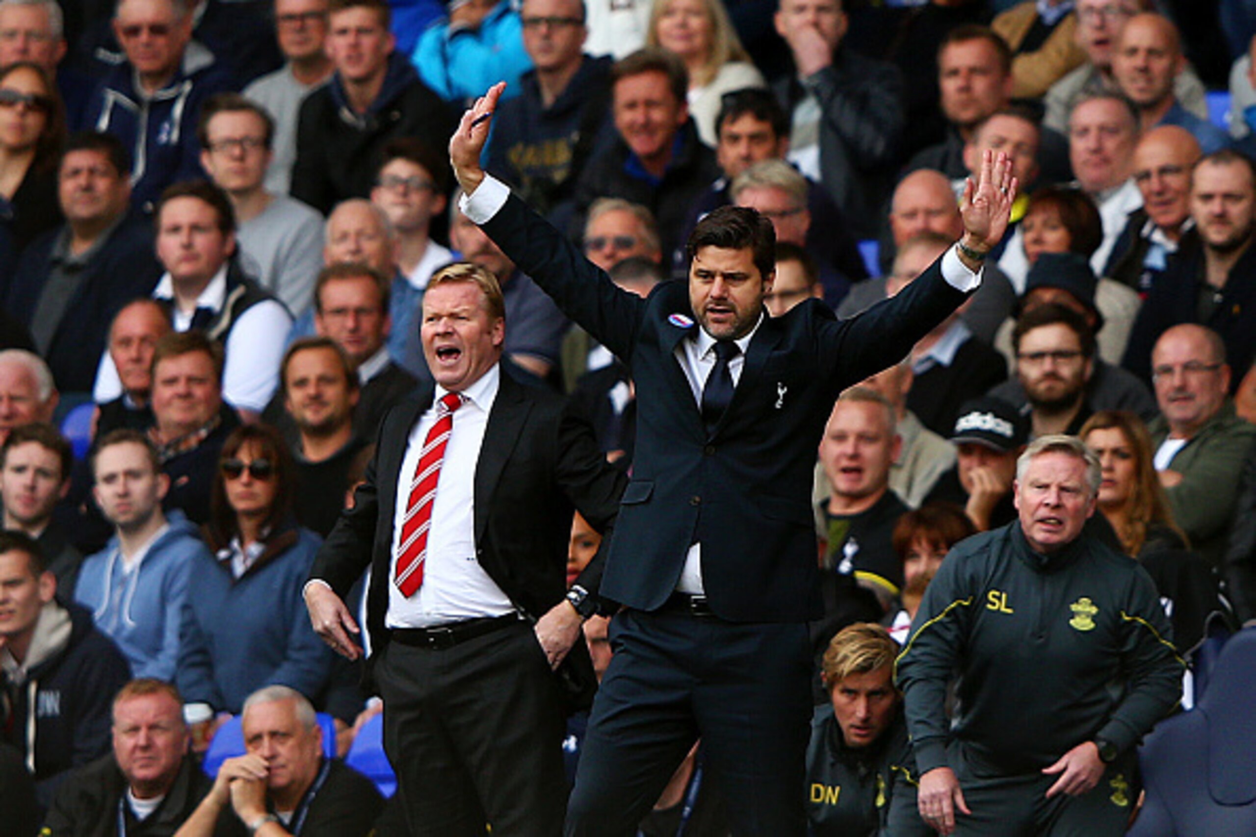 LONDON, ENGLAND - OCTOBER 05:  Manager Mauricio Pochettino of Spurs and Ronald Koeman manager of Southampton react on the touchline during the Barclays Premier League match between Tottenham Hotspur and Southampton at White Hart Lane on October 5, 2014 in