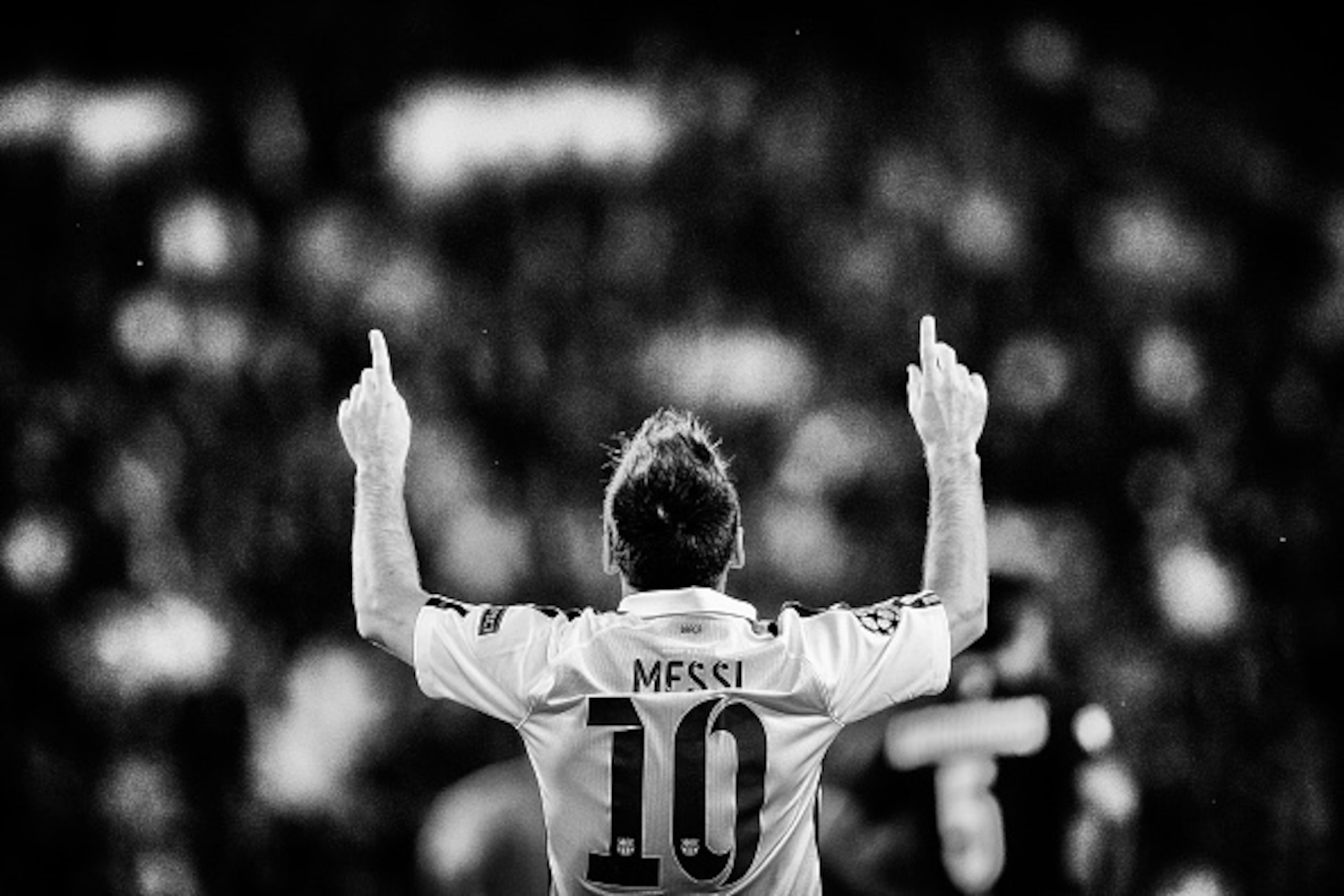 PARIS, FRANCE - SEPTEMBER 30:  (EDITORS NOTE: Image has been converted to black and white.)  Lionel Messi of Barcelona celebrates scoring his teams first goal of the game during the Group F UEFA Champions League match between Paris Saint-Germain v FC Barc