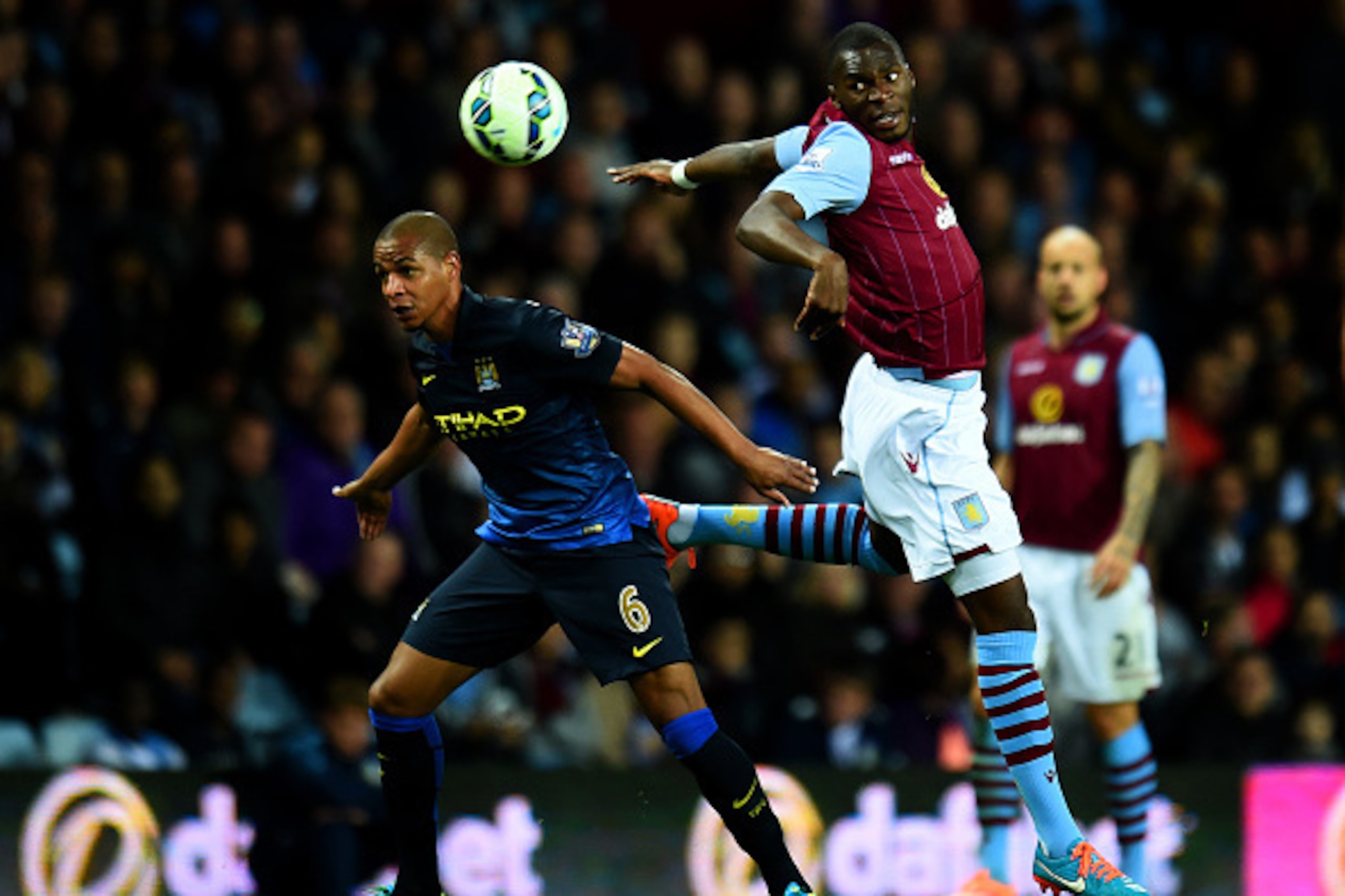 BIRMINGHAM, ENGLAND - OCTOBER 04:  Christian Benteke of Aston Villa battles for the ball with Fernando of Manchester City during the Barclays Premier League match between Aston Villa and Manchester City at Villa Park on October 4, 2014 in Birmingham, Engl
