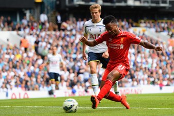 LONDON, ENGLAND - AUGUST 31:  Raheem Sterling of Liverpool scores the opening goal during the Barclays Premier League match between Tottenham Hotspur and Liverpool at White Hart Lane on August 31, 2014 in London, England.  (Photo by Jamie McDonald/Getty I