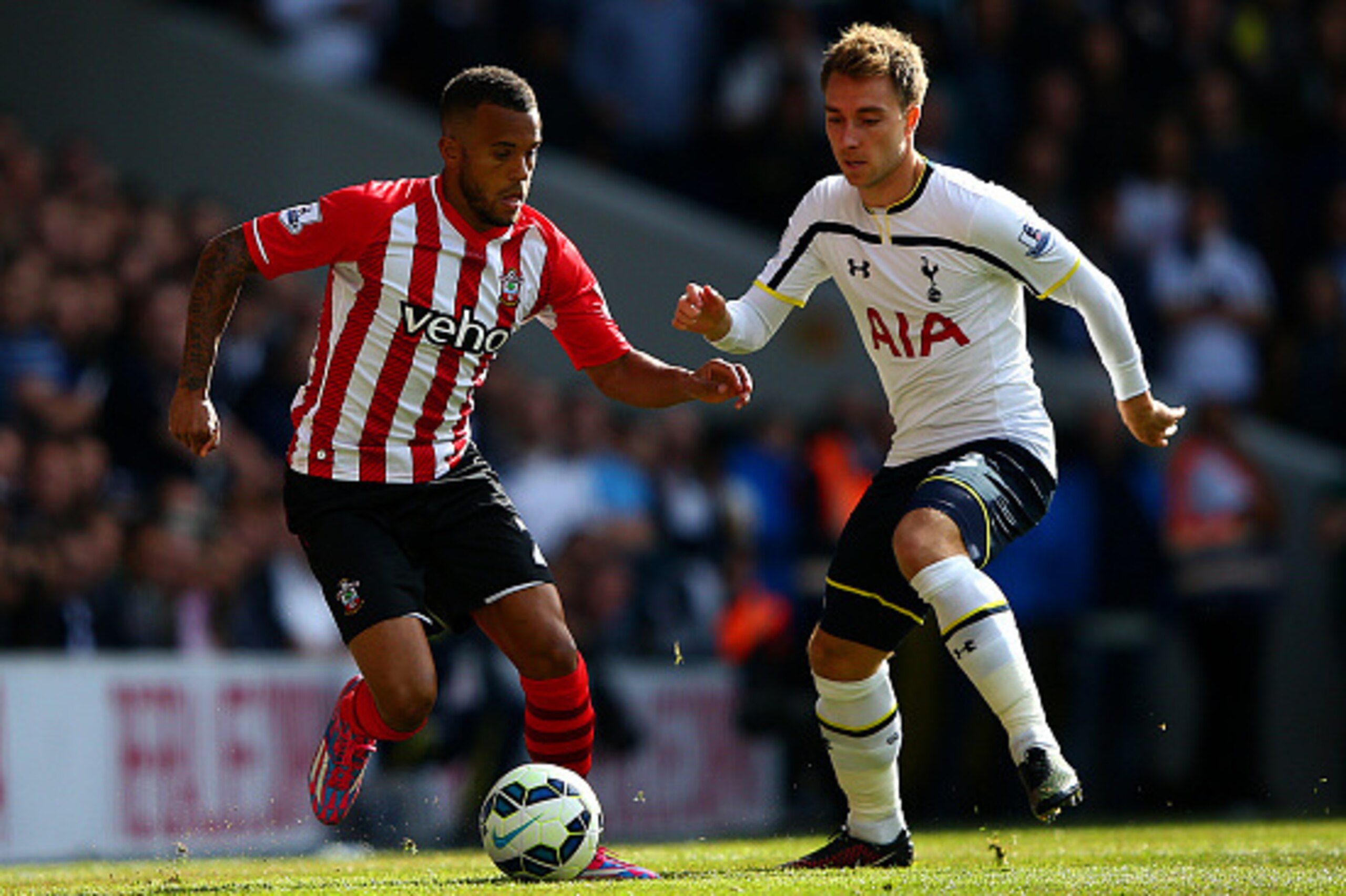 LONDON, ENGLAND - OCTOBER 05: Christian Eriksen of Spurs battles for the ball with Ryan Bertrand of Southampton during the Barclays Premier League match between Tottenham Hotspur and Southampton at White Hart Lane on October 5, 2014 in London, England. LONDON, ENGLAND - OCTOBER 05: Christian Eriksen of Spurs battles for the ball with Ryan Bertrand of Southampton during the Barclays Premier League match between Tottenham Hotspur and Southampton at White Hart Lane on October 5, 2014 in London, England.