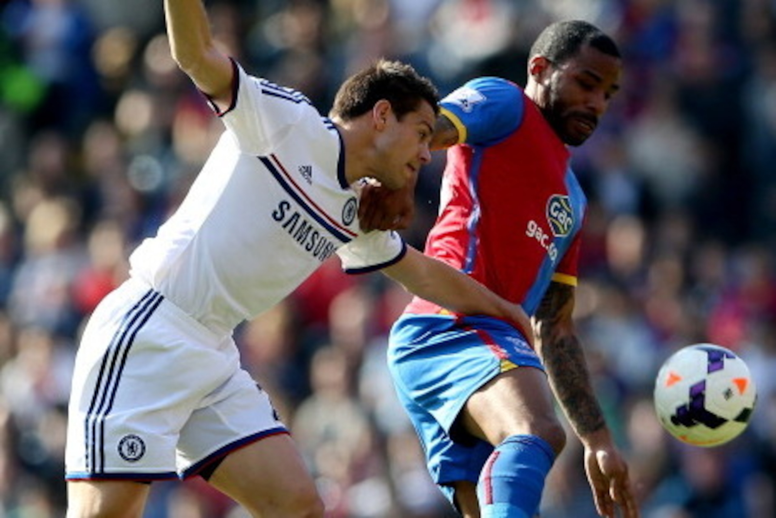 LONDON, ENGLAND - MARCH 29:  Jason Puncheon of Crystal Palace in action with Cesar Azpilicueta during the Barclays Premier League match between Crystal Palace and Chelsea at Selhurst Park on March 29, 2014 in London, England.  (Photo by Scott Heavey/Getty