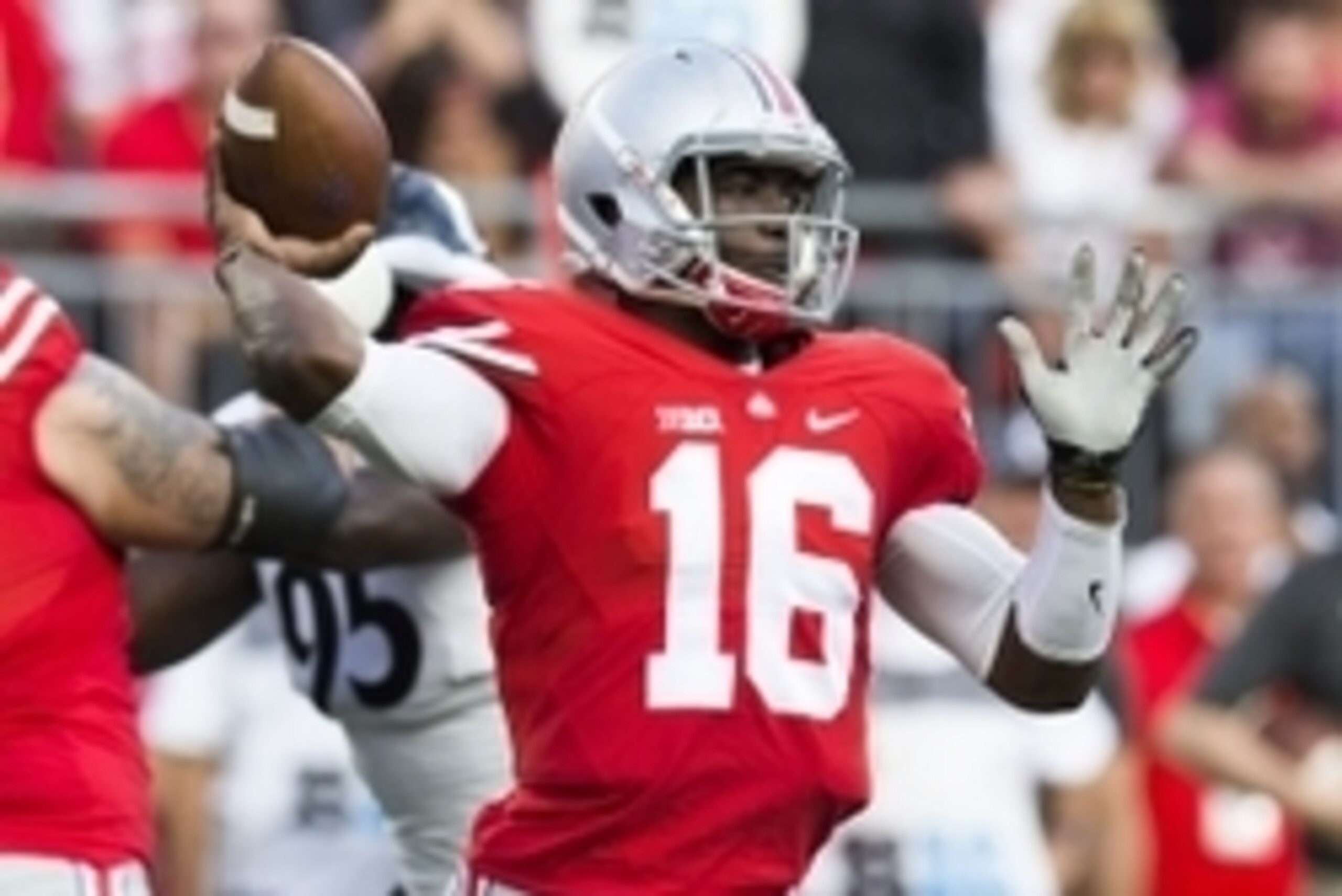 Sep 27, 2014; Columbus, OH, USA; Ohio State Buckeyes quarterback J.T. Barrett (16) throws a pass against the Cincinnati Bearcats at Ohio Stadium. Mandatory Credit: Greg Bartram-USA TODAY Sports