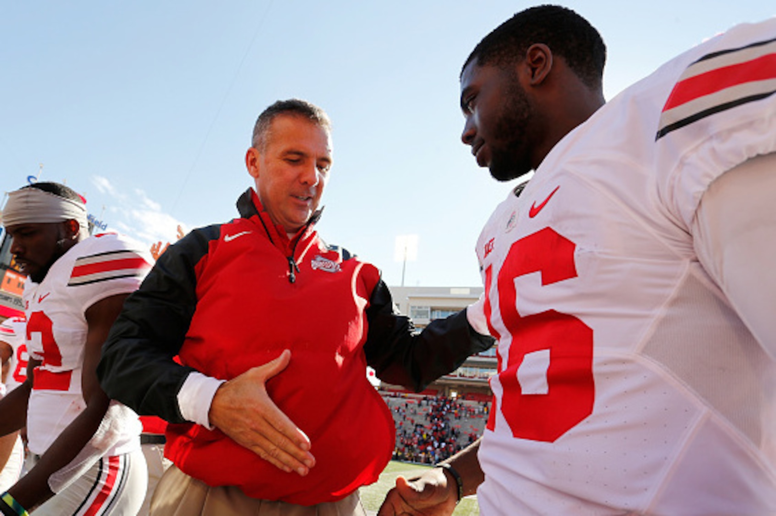 COLLEGE PARK, MD - OCTOBER 04:  Head coach Urban Meyer of the Ohio State Buckeyes (L) shakes hands with quarterback J.T. Barrett #16 (R) after their 52-24 win over the Maryland Terrapins at Byrd Stadium on October 4, 2014 in College Park, Maryland.  (Phot
