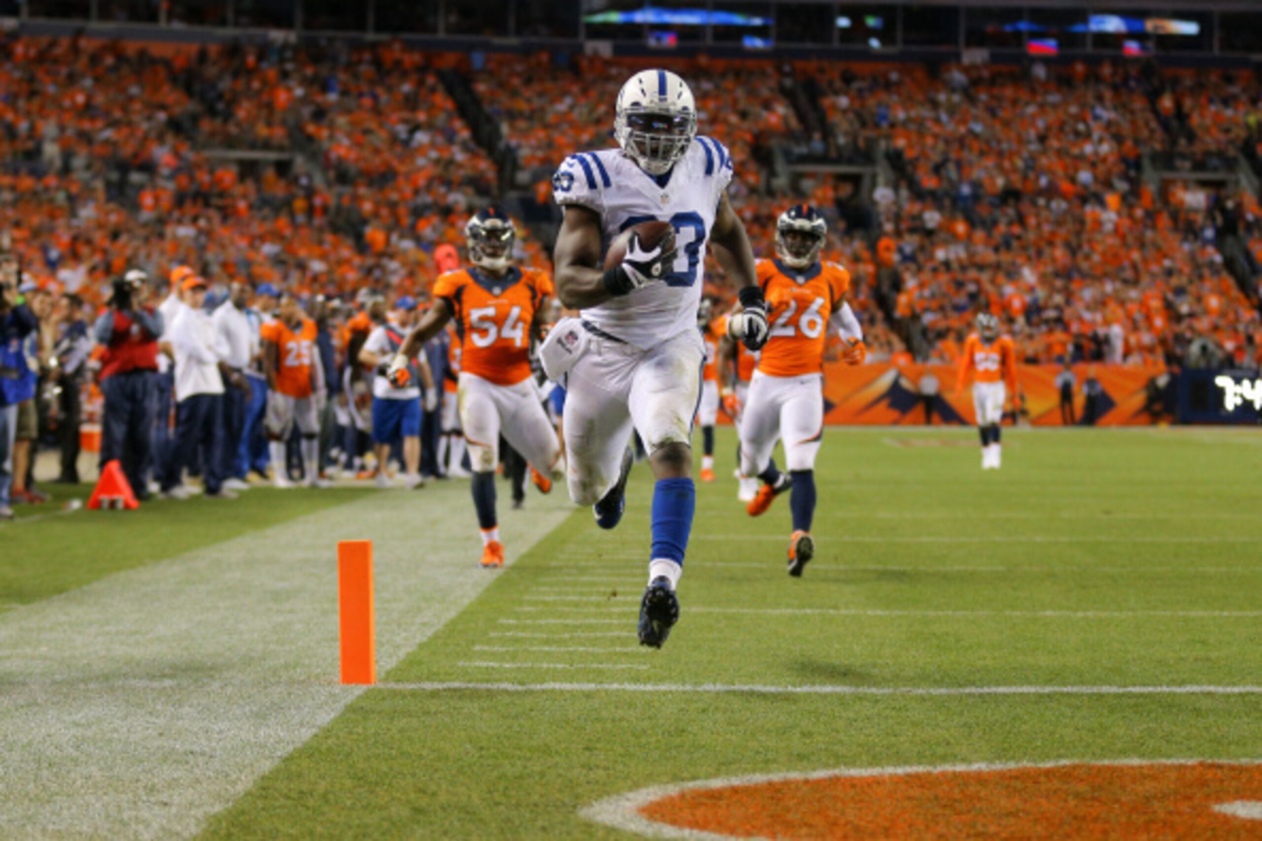 DENVER, CO - SEPTEMBER 7:  Tight end Dwayne Allen #83 of the Indianapolis Colts runs the ball into the end zone with a 41-yard fourth quarter touchdown against the Denver Broncos at Sports Authority Field at Mile High on September 7, 2014 in Denver, Color