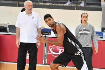 ISTANBUL, TURKEY - OCTOBER 10: Head Coach Gregg Popovich, Assistant Coach Becky Hammon and Tim Duncan #21 of the San Antonio Spurs look on during practice as part of the NBA Global Games on October 10, 2014 at the Darussafaka Practice Facility in Istanbul