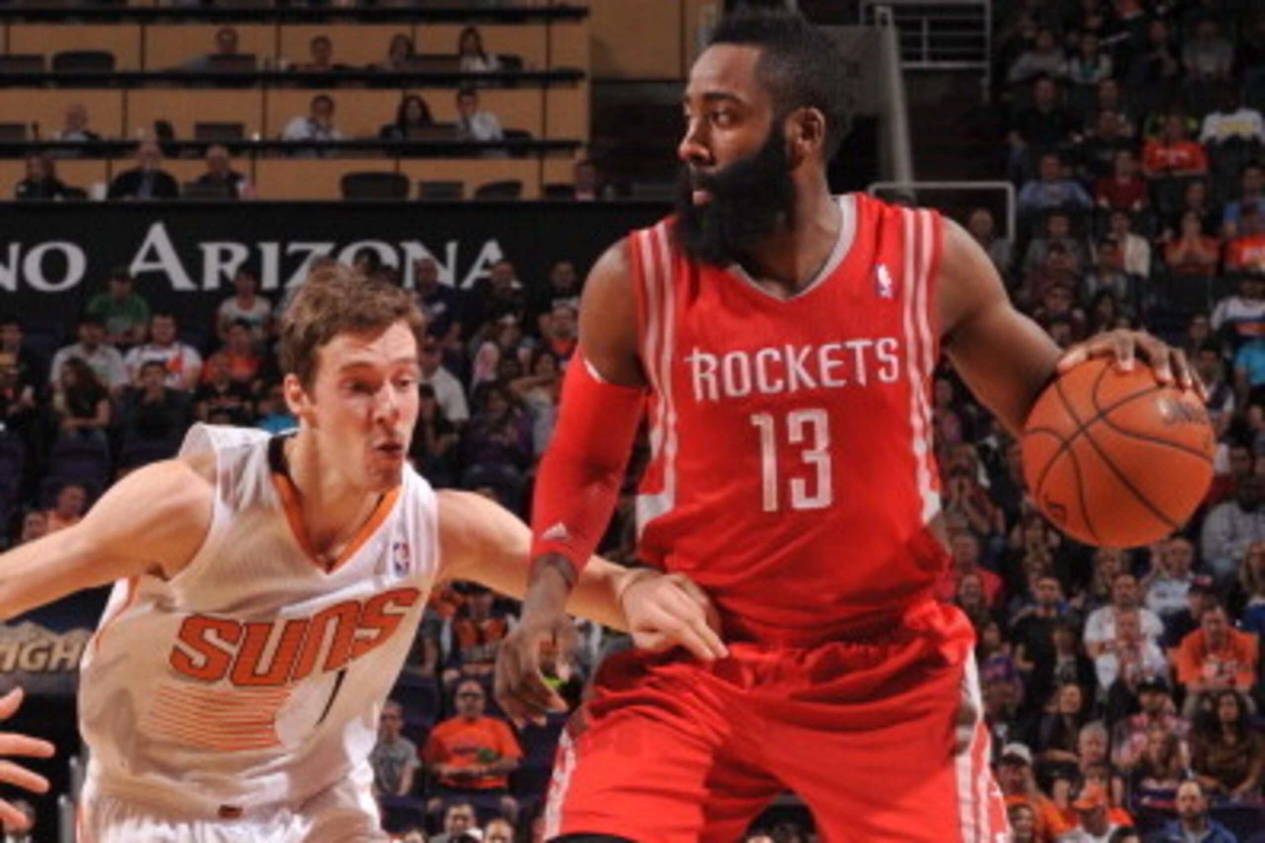PHOENIX, AZ - FEBRUARY 23: James Harden #13 of the Houston Rockets handles the ball against the Phoenix Suns on February 23, 2014 at U.S. Airways Center in Phoenix, Arizona. NOTE TO USER: User expressly acknowledges and agrees that, by downloading and or 