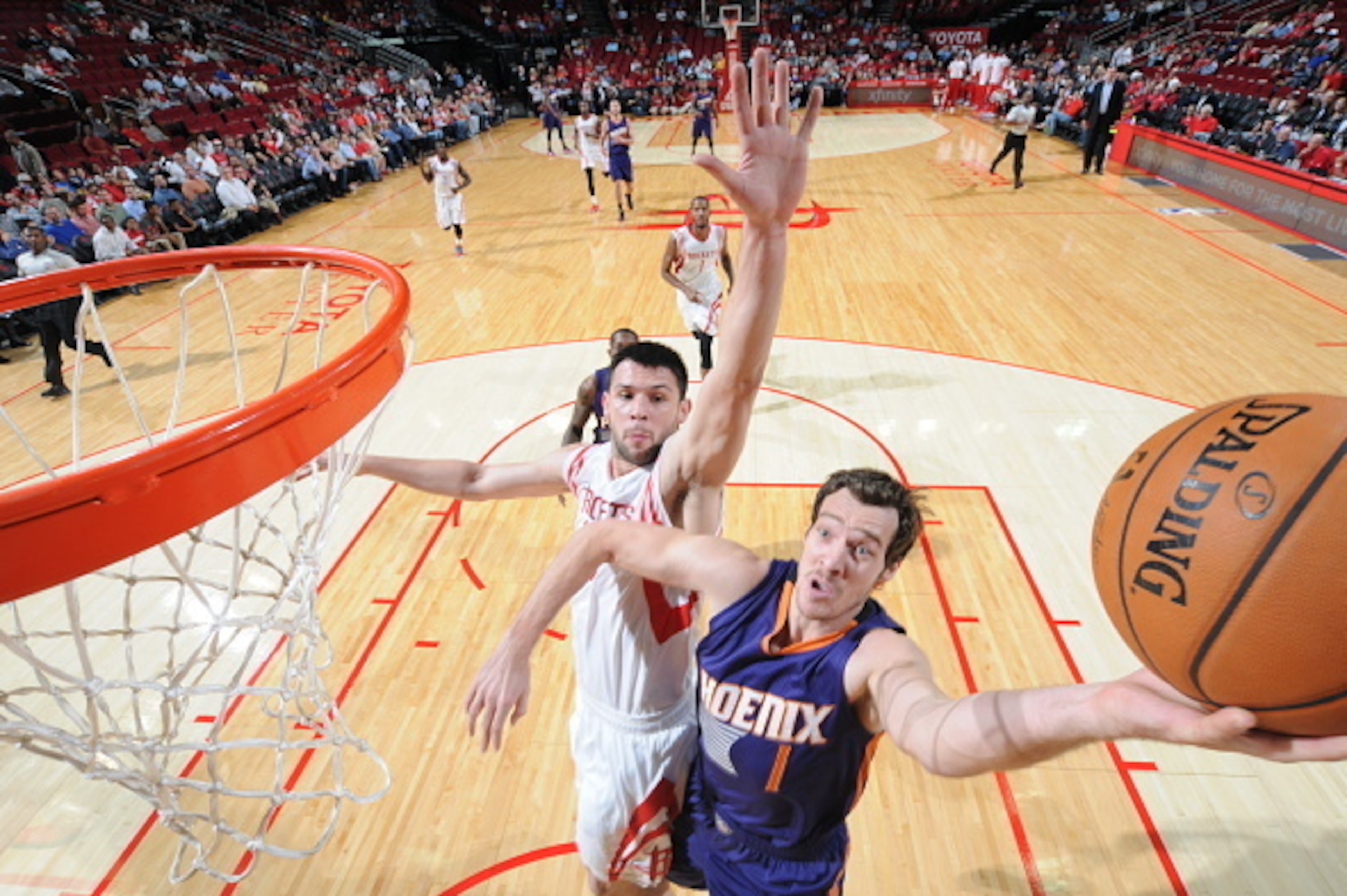 HOUSTON, TX - OCTOBER 13:  Goran Dragic #1 of the Phoenix Suns goes up for a shot against the Houston Rockets on October 13, 2014 at the Toyota Center in Houston, Texas. NOTE TO USER: User expressly acknowledges and agrees that, by downloading and or usin