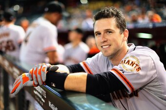 PHOENIX, AZ - SEPTEMBER 17:  Buster Posey #28 of the San Francisco Giants watches from the dugout during the MLB game against the Arizona Diamondbacks at Chase Field on September 17, 2014 in Phoenix, Arizona.  (Photo by Christian Petersen/Getty Images)