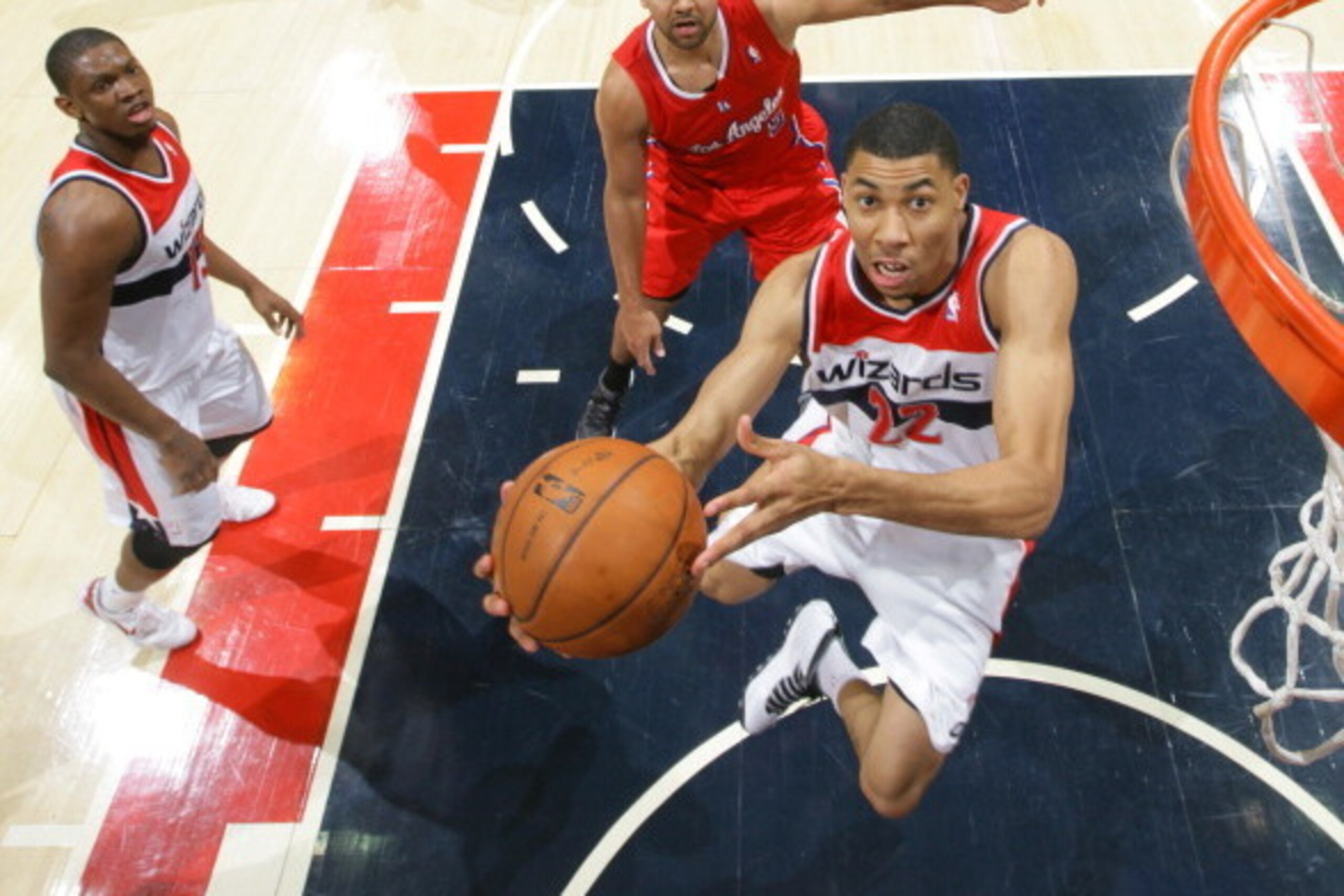 WASHINGTON, DC - DECEMBER 14: Otto Porter #22 of the Washington Wizards shoots against Jared Dudley #9 of the Los Angeles Clippers during the game at the Verizon Center on December 14, 2013 in Washington, DC. NOTE TO USER: User expressly acknowledges and 