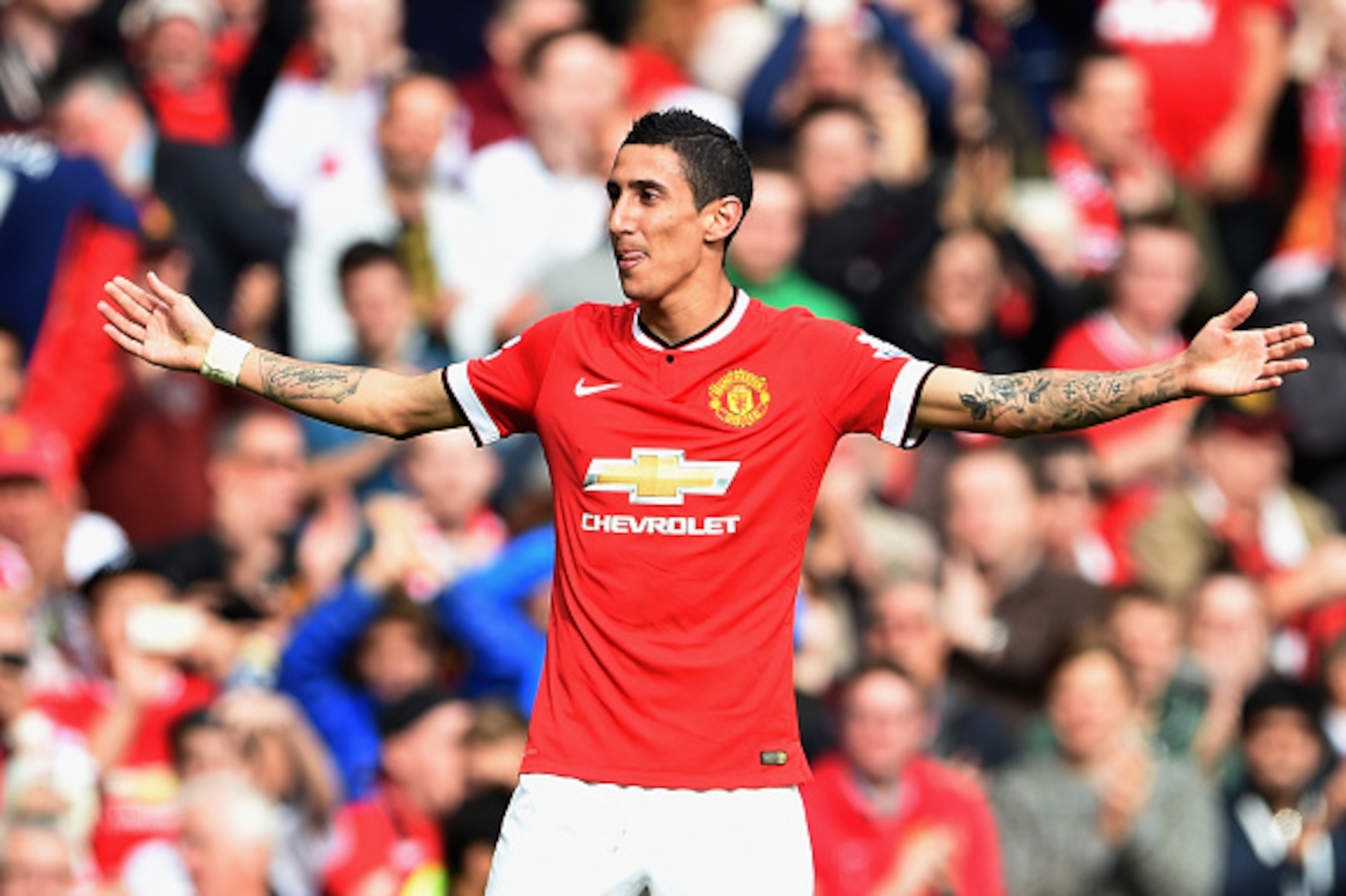 MANCHESTER, ENGLAND - OCTOBER 05:  Angel Di Maria of Manchester United celebrates scoring the first goal during the Barclays Premier League match between Manchester United and Everton at Old Trafford on October 5, 2014 in Manchester, England.  (Photo by M