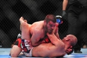 Dec 29, 2012; Las Vegas, NV, USA; Jim Miller (top) and Joe Lauzon (bottom) lock up during UFC 155 at the MGM Grand Garden Arena. Mandatory Credit: Gary A. Vasquez-USA TODAY Sports