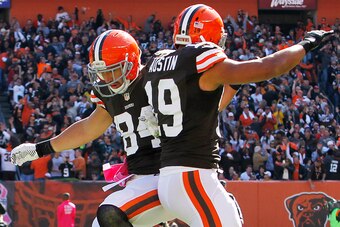 Oct 12, 2014; Cleveland, OH, USA; Cleveland Browns tight end Jordan Cameron (84) celebrates with wide receiver Miles Austin (19) after a pass reception during the second quarter at FirstEnergy Stadium. Mandatory Credit: Ron Schwane-USA TODAY Sports
