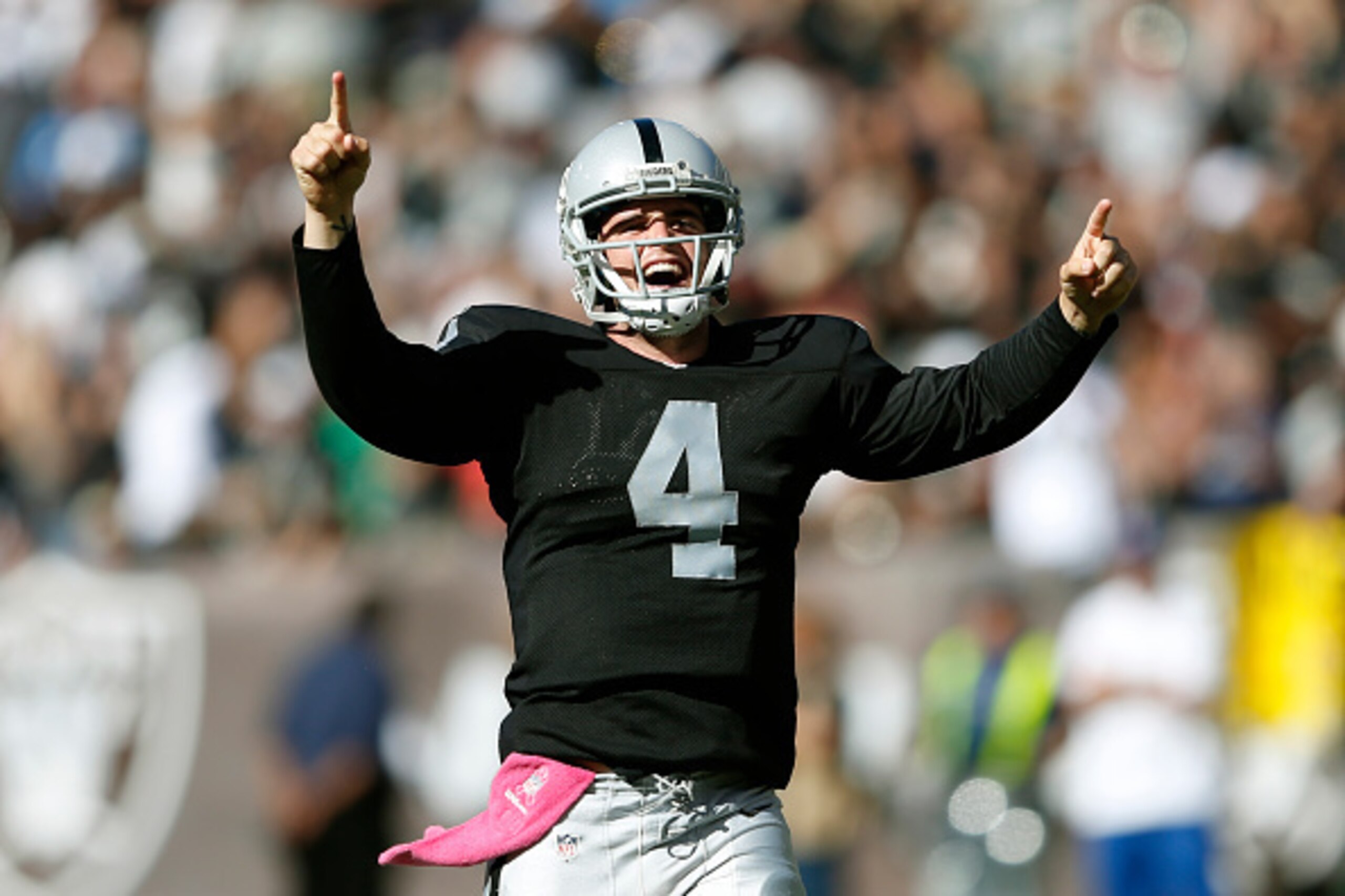 OAKLAND, CA - OCTOBER 12:  Derek Carr #4 of the Oakland Raiders celebrates after throwing a 47-seven-yard touchdown pass against the San Diego Chargers during the third quarter at the O.co Coliseum in Oakland, California. The Chargers won the game 31-28. 