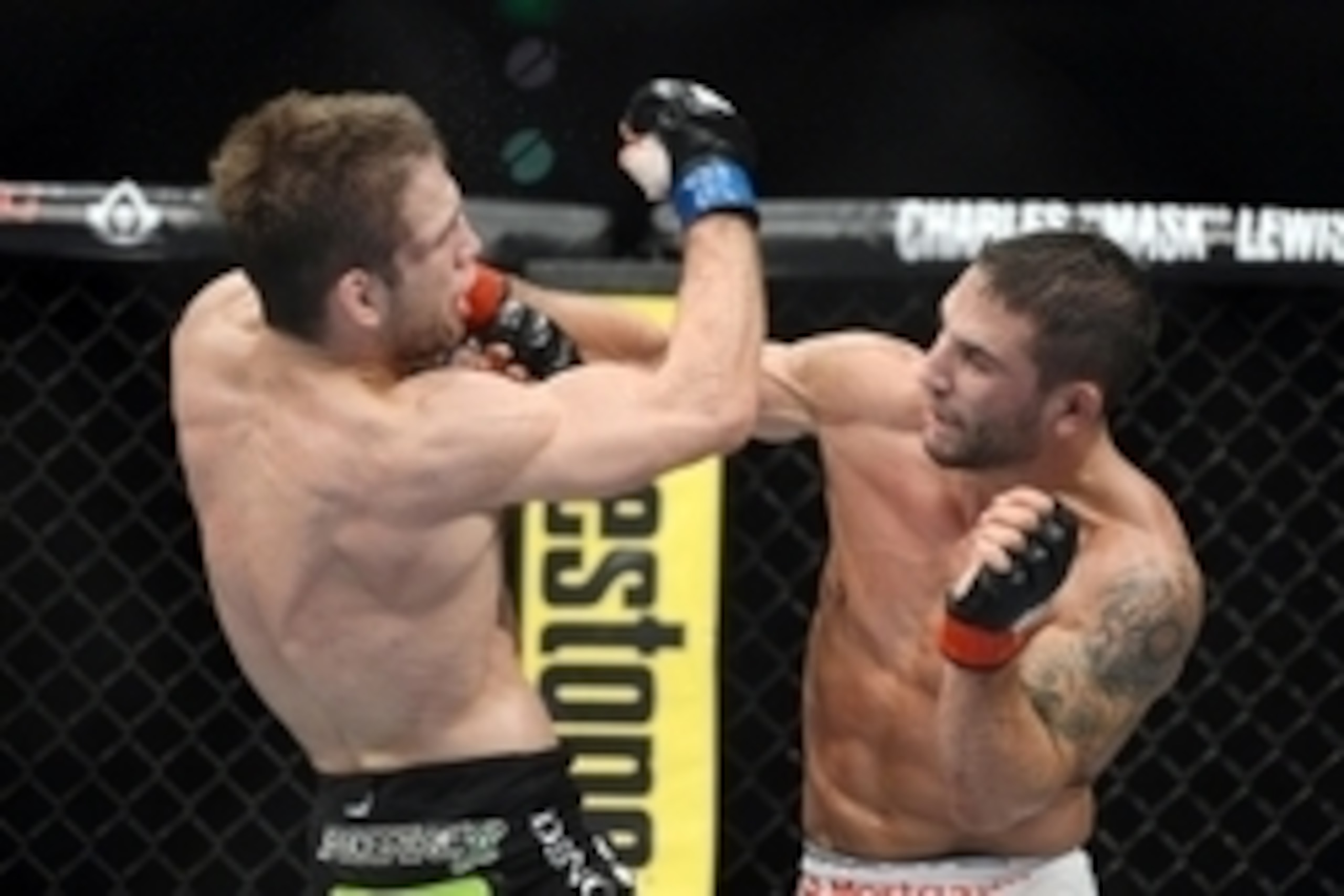 December 14, 2013; Sacramento, CA, USA; Chad Mendes (red gloves) fights Nik Lentz (blue gloves) during the featherweight bout of the UFC on FOX 9 at Sleep Train Arena. Mandatory Credit: Kyle Terada-USA TODAY Sports