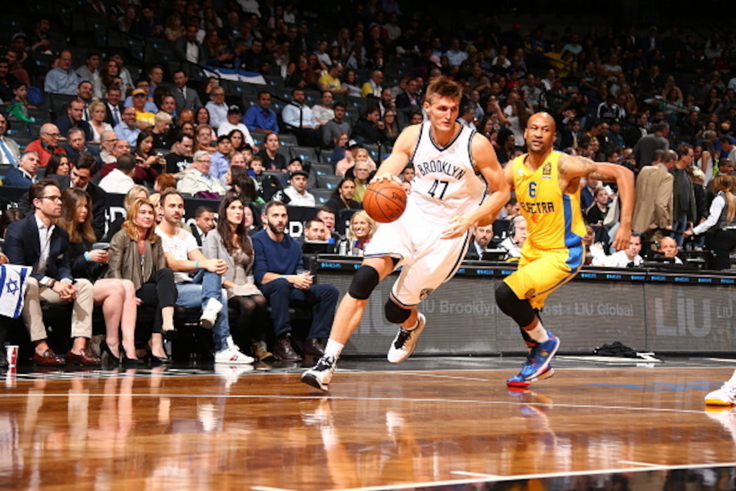 NEW YORK, NY - OCTOBER 7: Andrei Kirilenko #47 of the Brooklyn Nets dribbles the ball against Devin Smith #6 of the Maccabi Tel Aviv at the Barclays Center on October 7, 2014 in the Brooklyn borough of New York City. NOTE TO USER: User expressly acknowle NEW YORK, NY - OCTOBER 7: Andrei Kirilenko #47 of the Brooklyn Nets dribbles the ball against Devin Smith #6 of the Maccabi Tel Aviv at the Barclays Center on October 7, 2014 in the Brooklyn borough of New York City. NOTE TO USER: User expressly acknowle