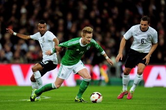 LONDON, ENGLAND - NOVEMBER 19:  Marco Reus of Germany takes on Ashley Cole of England during the international friendly match between England and Germany at Wembley Stadium on November 19, 2013 in London, England.  (Photo by Shaun Botterill/Getty Images)