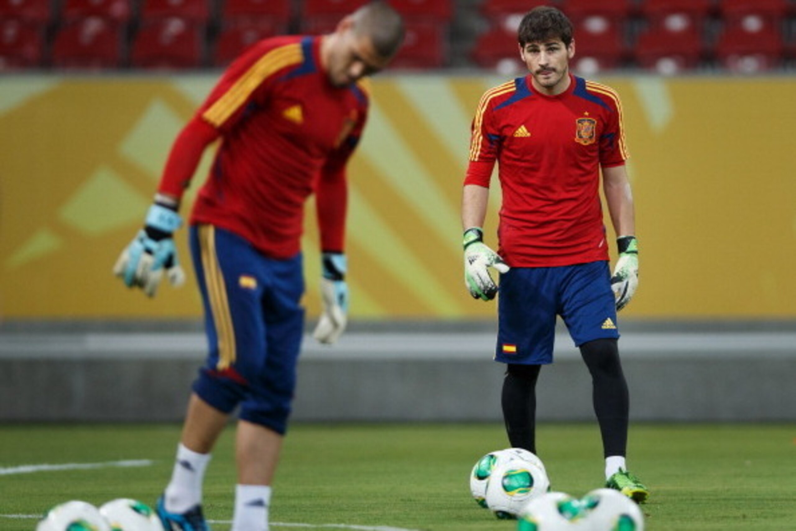 RECIFE, BRAZIL - JUNE 15: Goalkeeper Iker Casillas (R) of Spain flanked by his teammate Victor Valdes during a training session, ahead of their FIFA Confederations Cup Brazil 2013 opening game against Uruguay, at the Pernambuco Stadium on June 15, 2013 RECIFE, BRAZIL - JUNE 15: Goalkeeper Iker Casillas (R) of Spain flanked by his teammate Victor Valdes during a training session, ahead of their FIFA Confederations Cup Brazil 2013 opening game against Uruguay, at the Pernambuco Stadium on June 15, 2013