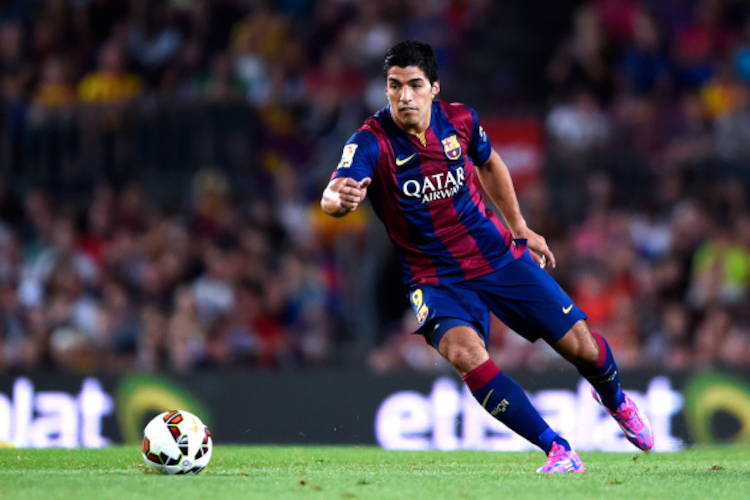 BARCELONA, SPAIN - AUGUST 18:  Luis Suarez of FC Barcelona runs with the ball during the Joan Gamper Trophy match between FC Barcelona and Club Leon at Camp Nou on August 18, 2014 in Barcelona, Spain.  (Photo by David Ramos/Getty Images)
