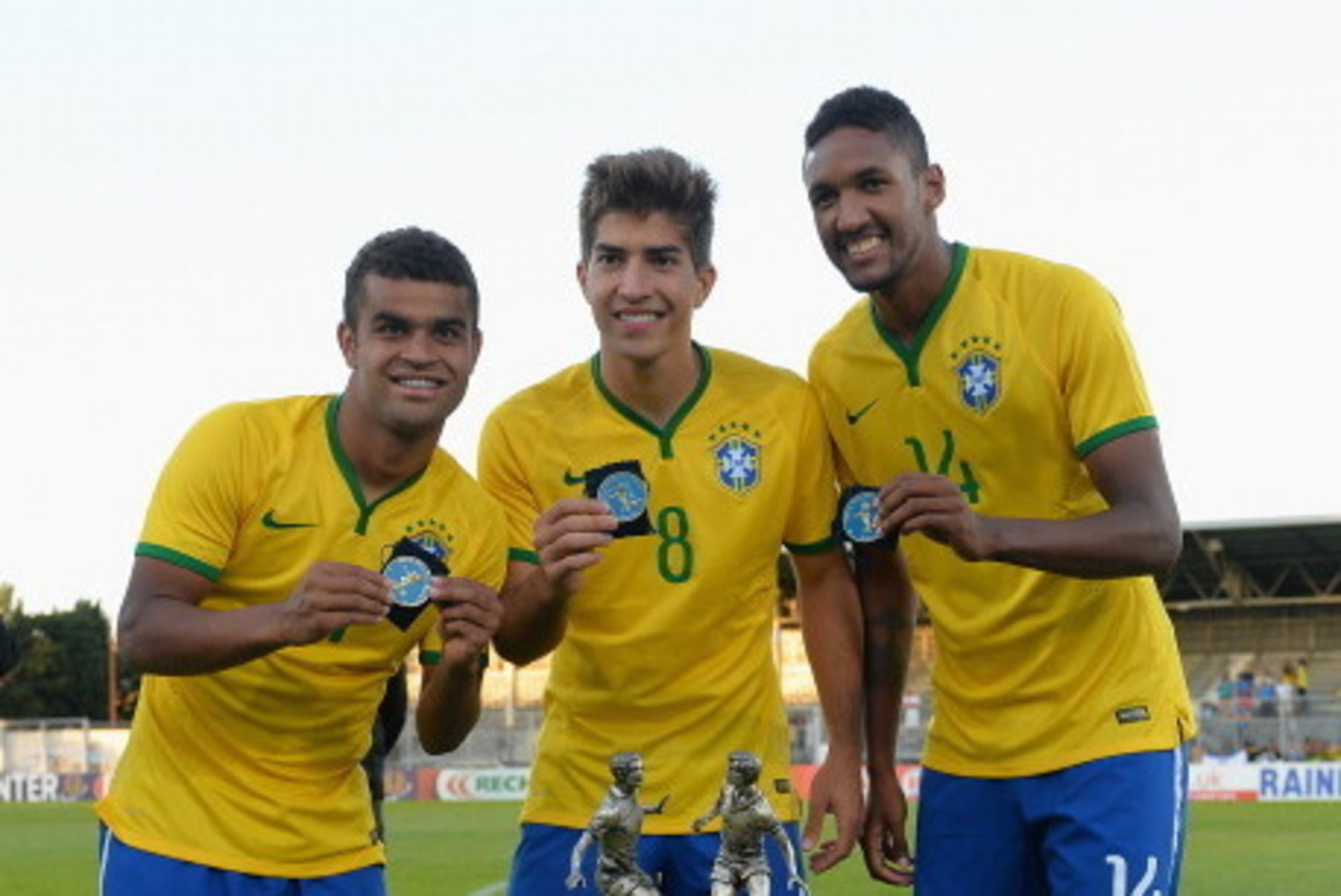 AVIGNON, FRANCE - JUNE 01:  Alisson, Lucas Silva and Wallace of Brazil celebrate their victory with the trophy during the Final of the Toulon Tournament between France and Brazil at the Parc des Sports Avignon on June 1, 2014 in Avignon, France.  (Photo b
