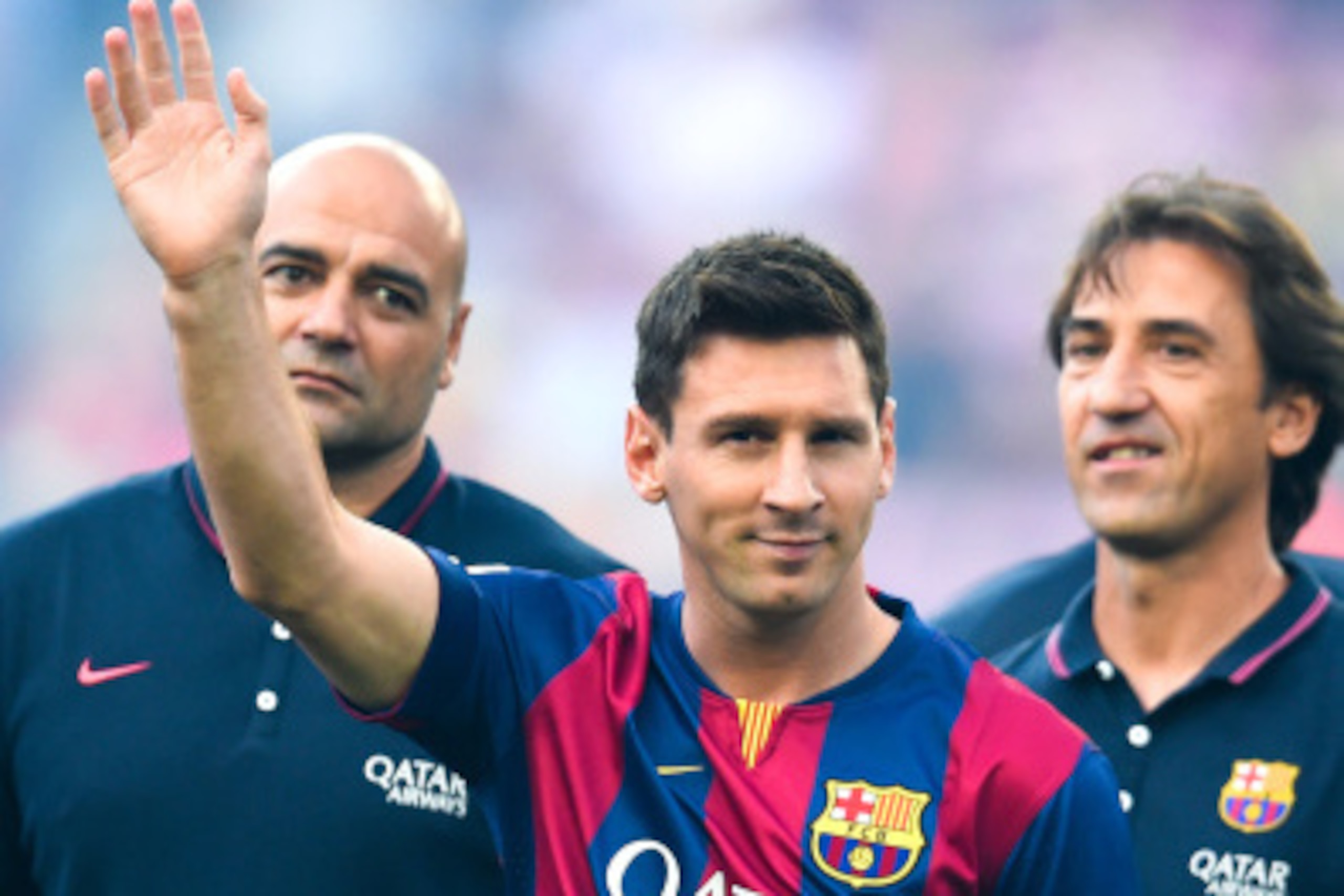 BARCELONA, SPAIN - AUGUST 18: Lionel Messi of FC Barcelona waves during the official presentation of the FC Barcelona prior to the Joan Gamper Trophy match between FC Barcelona and Club Leon at Camp Nou on August 18, 2014 in Barcelona, Spain.  (Photo by D