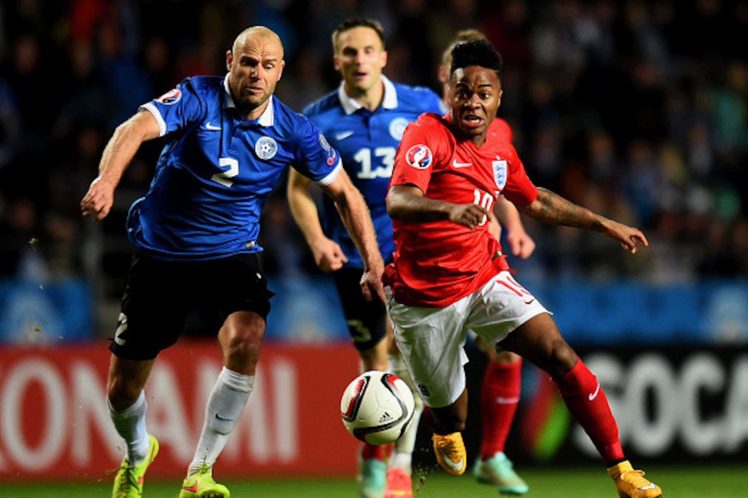 TALLINN, ESTONIA - OCTOBER 12:  Raheem Sterling of England is challenged by Joal Lindpere of Estonia during the EURO 2016 Qualifier match between Estonia and England at A. Le Coq Arena on October 12, 2014 in Tallinn, Estonia.  (Photo by Shaun Botterill/Ge